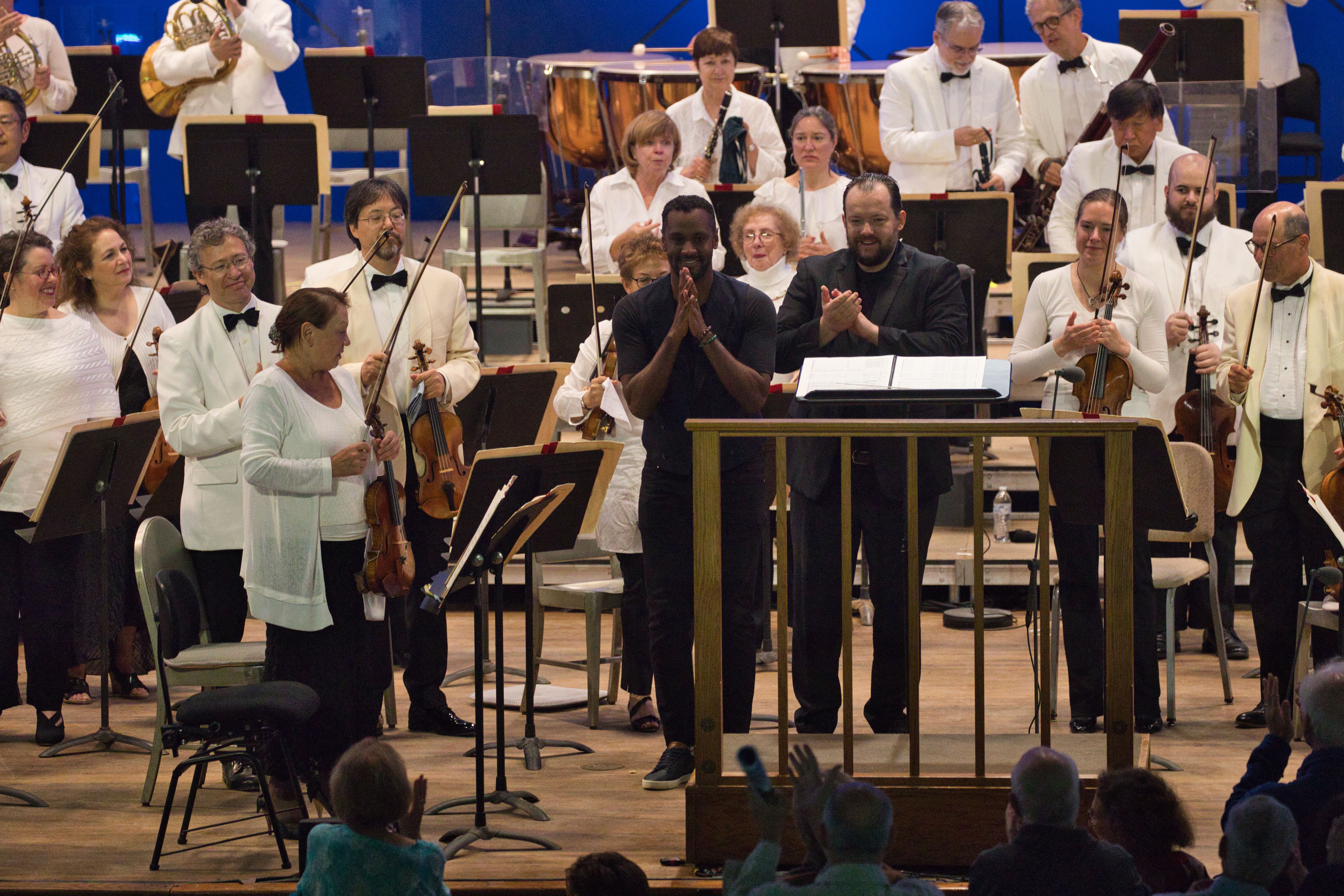 Composer Carlos Simon (center) took a bow with the BSO.