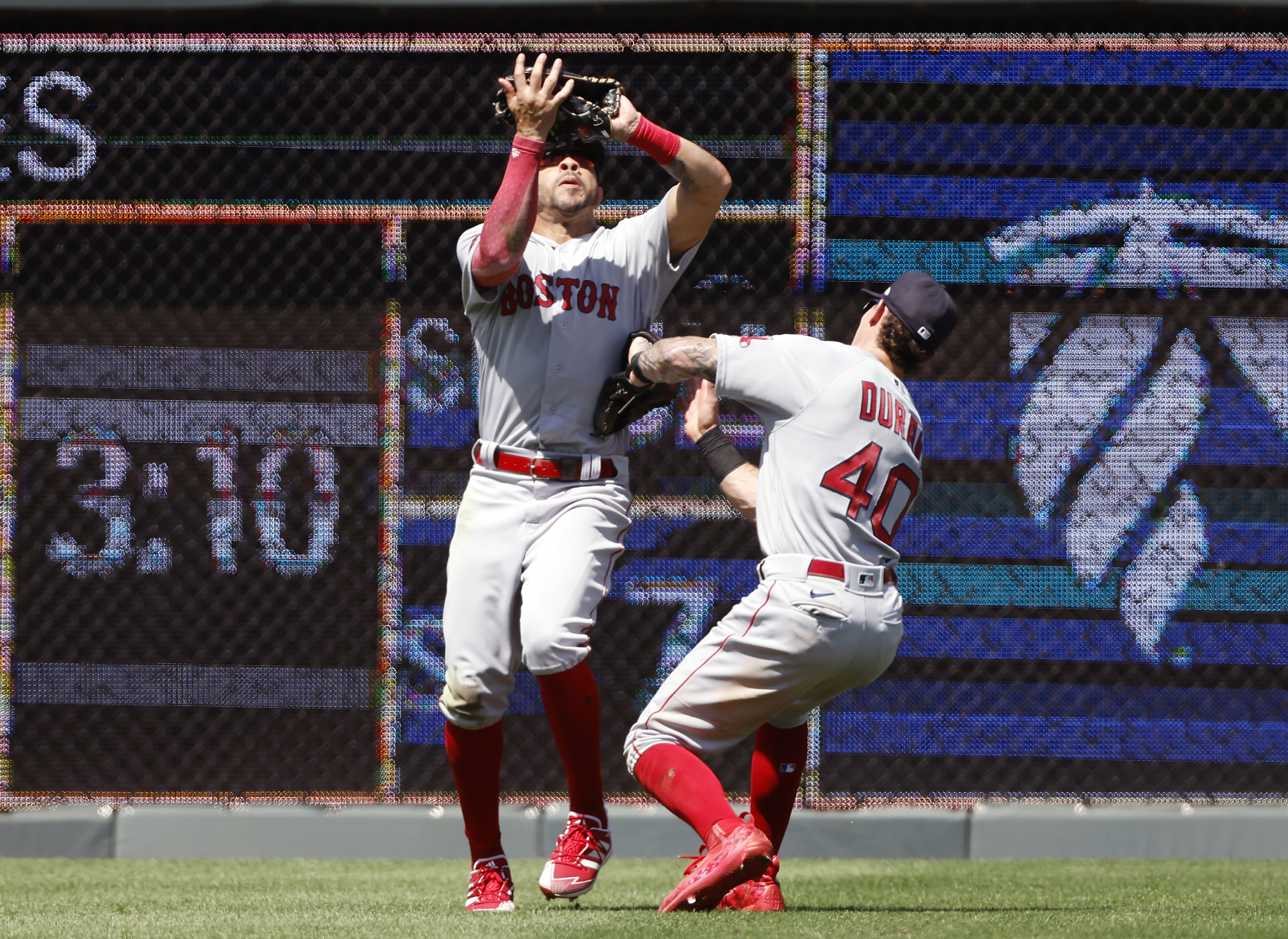 Jarren Duran of the Boston Red Sox reacts with Kiké Hernandez of
