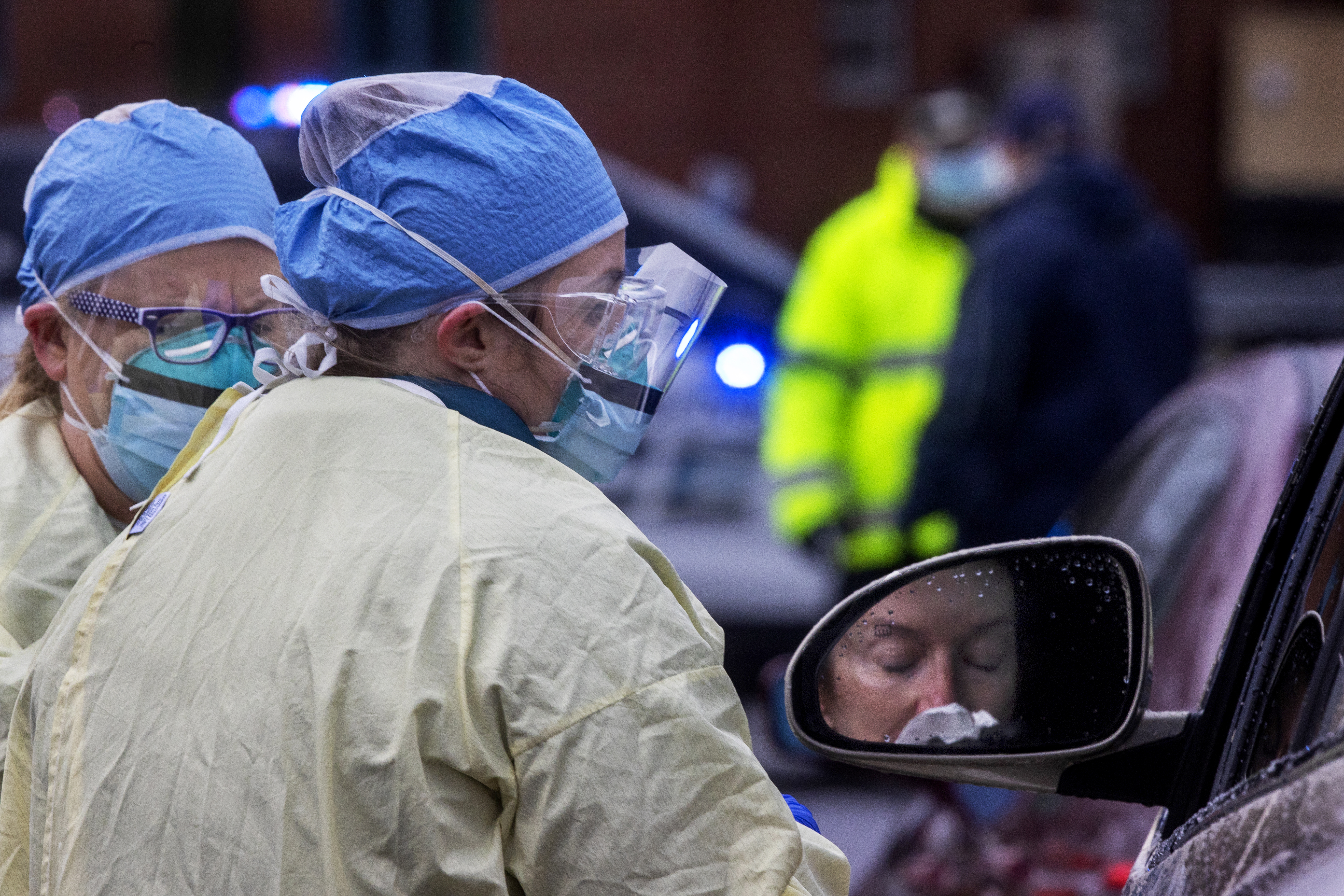 Medford, Ma- April 4, 2020 - Testing for the coronavirus at a drive-thru set up by PhysicianOne at Wellington Circle. (Stan Grossfeld/Globe Staff)