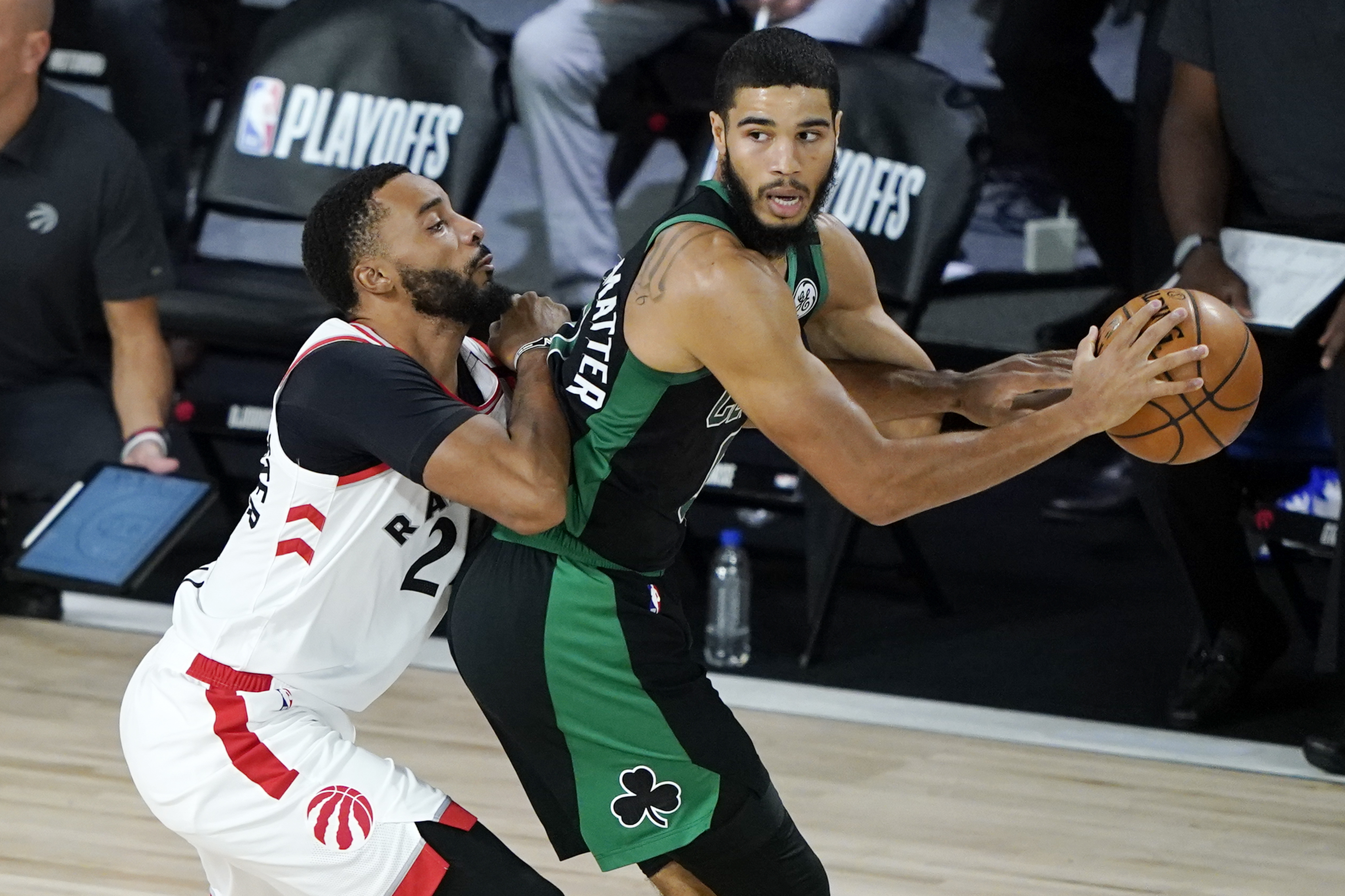 Toronto's Norman Powell defends against Jayson Tatum during the first half of Sunday's game.
