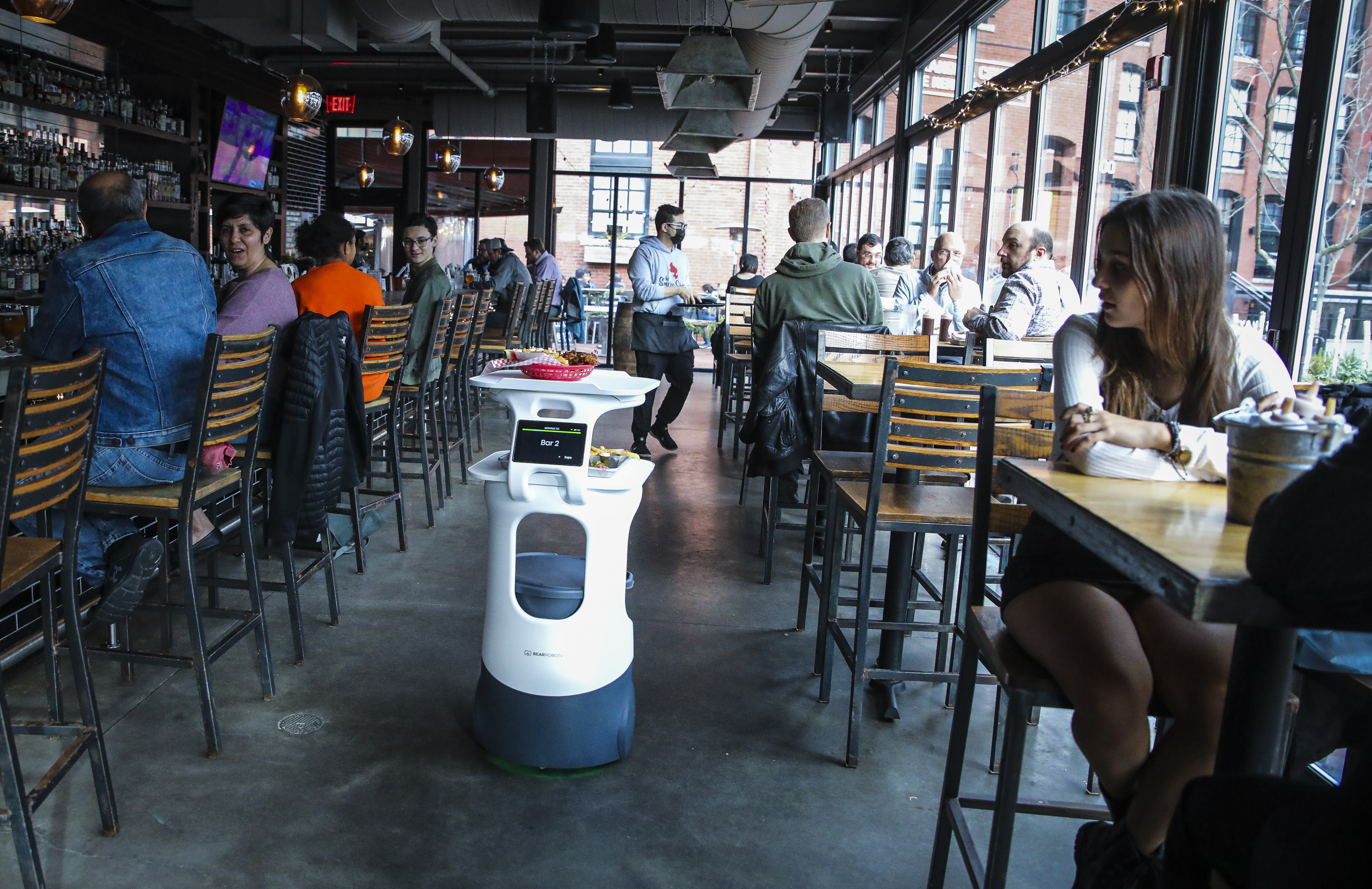 Faced with staffing shortages, The Smoke Shop BBQ employed the help of the robot to add an “extra set of hands” to their team.