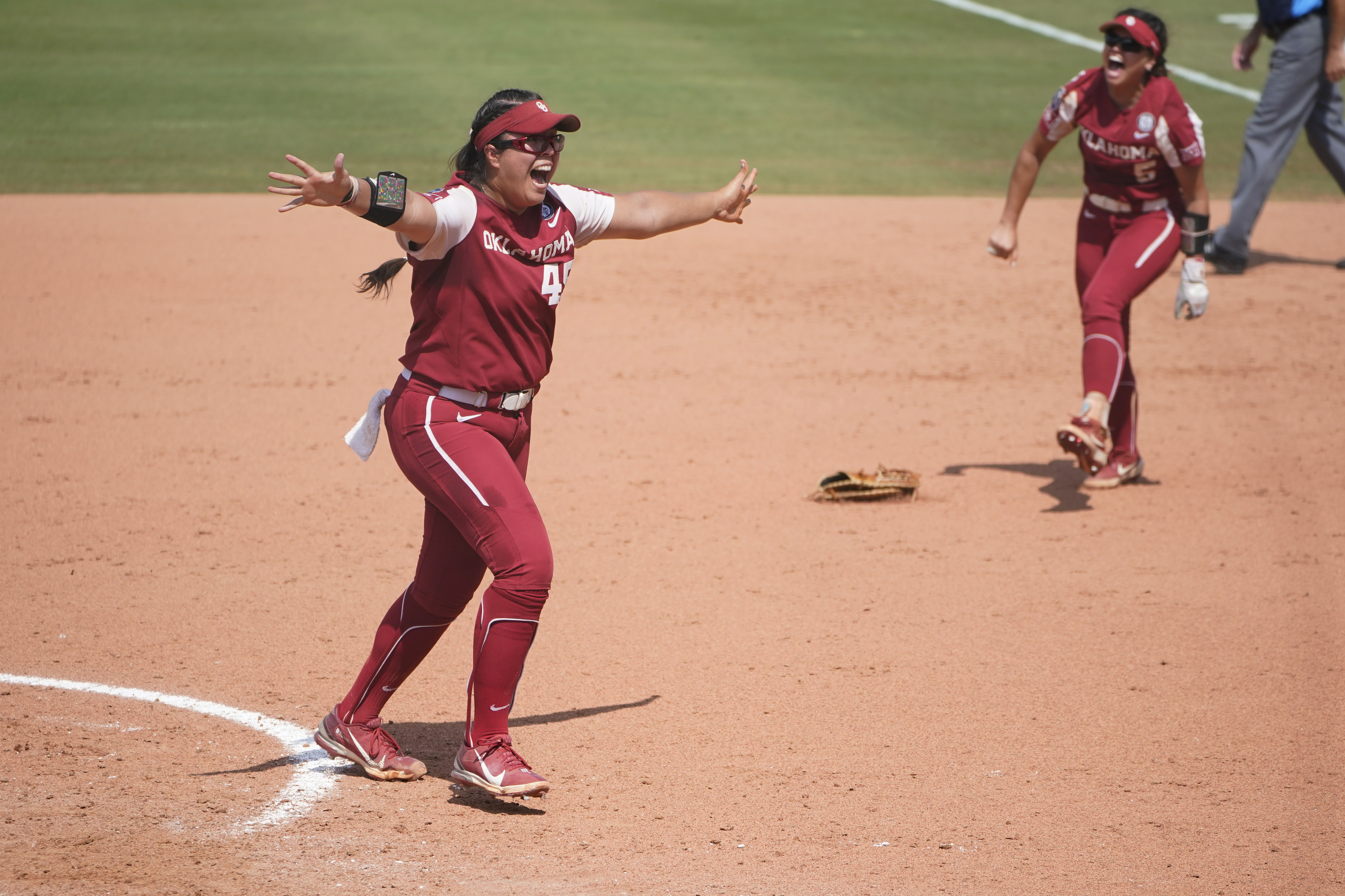 Giselle Juarez and the Sooners start the celebration after the final out.