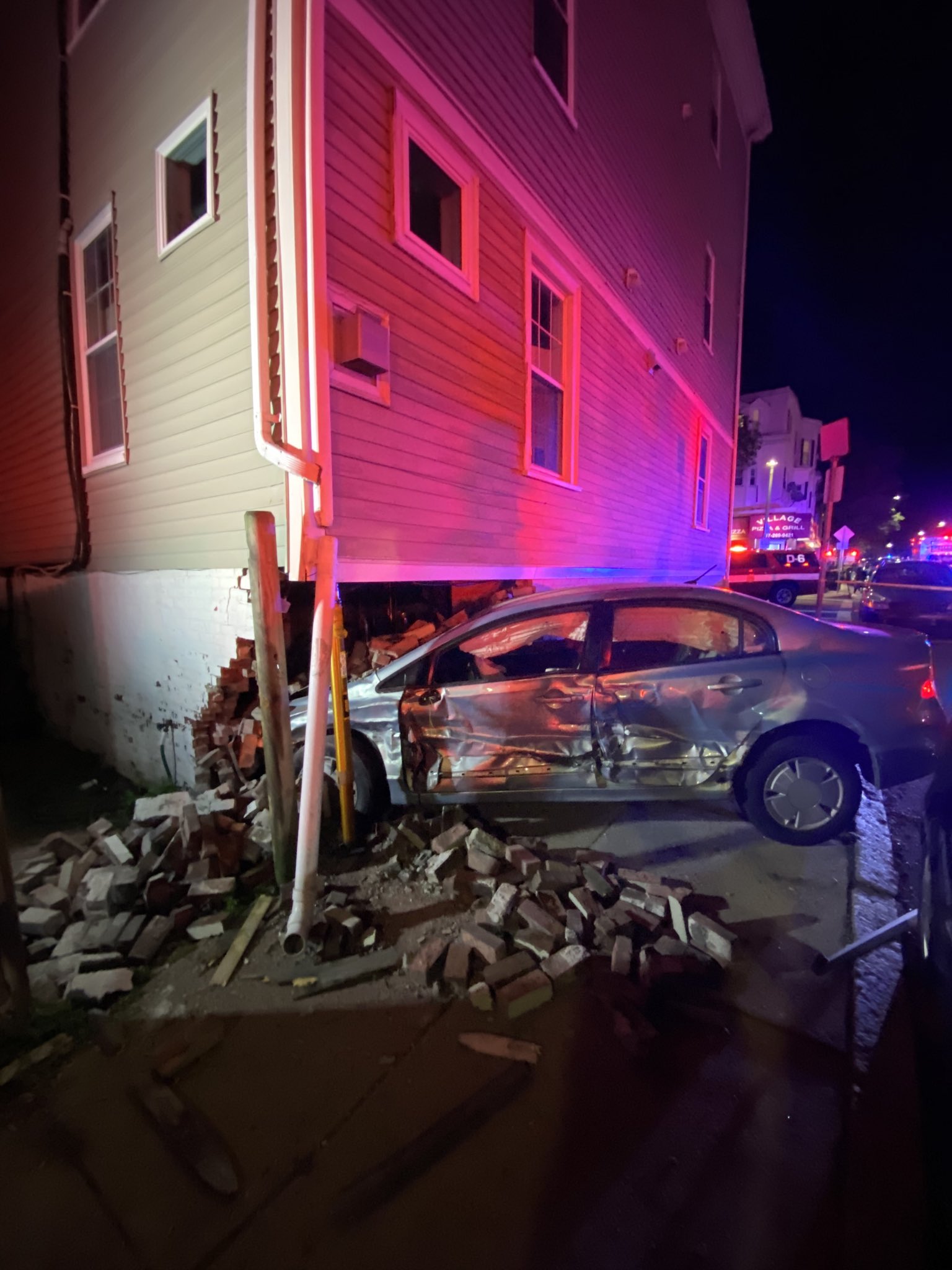 A car crashed into a residential building in South Boston Saturday night.
