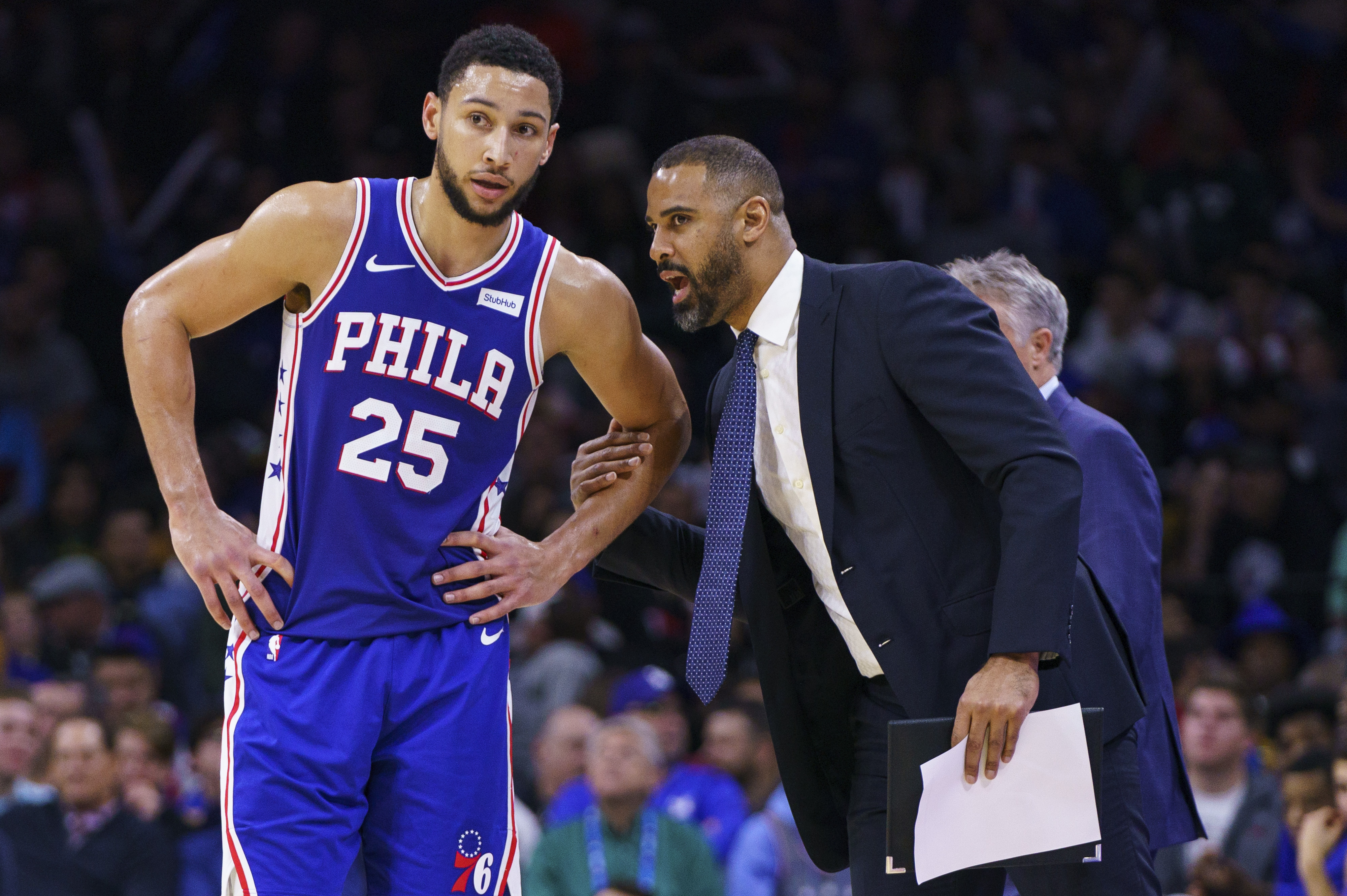 Ime Udoka, who spent a season as an assistant with the Sixers, talks with Philly's Ben Simmons during a 2019 game.