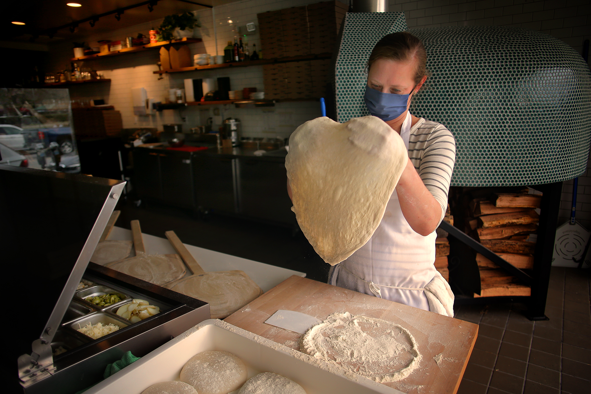 Co-owner Lydia Reichert at Jinny’s Pizzeria in Newton Centre.