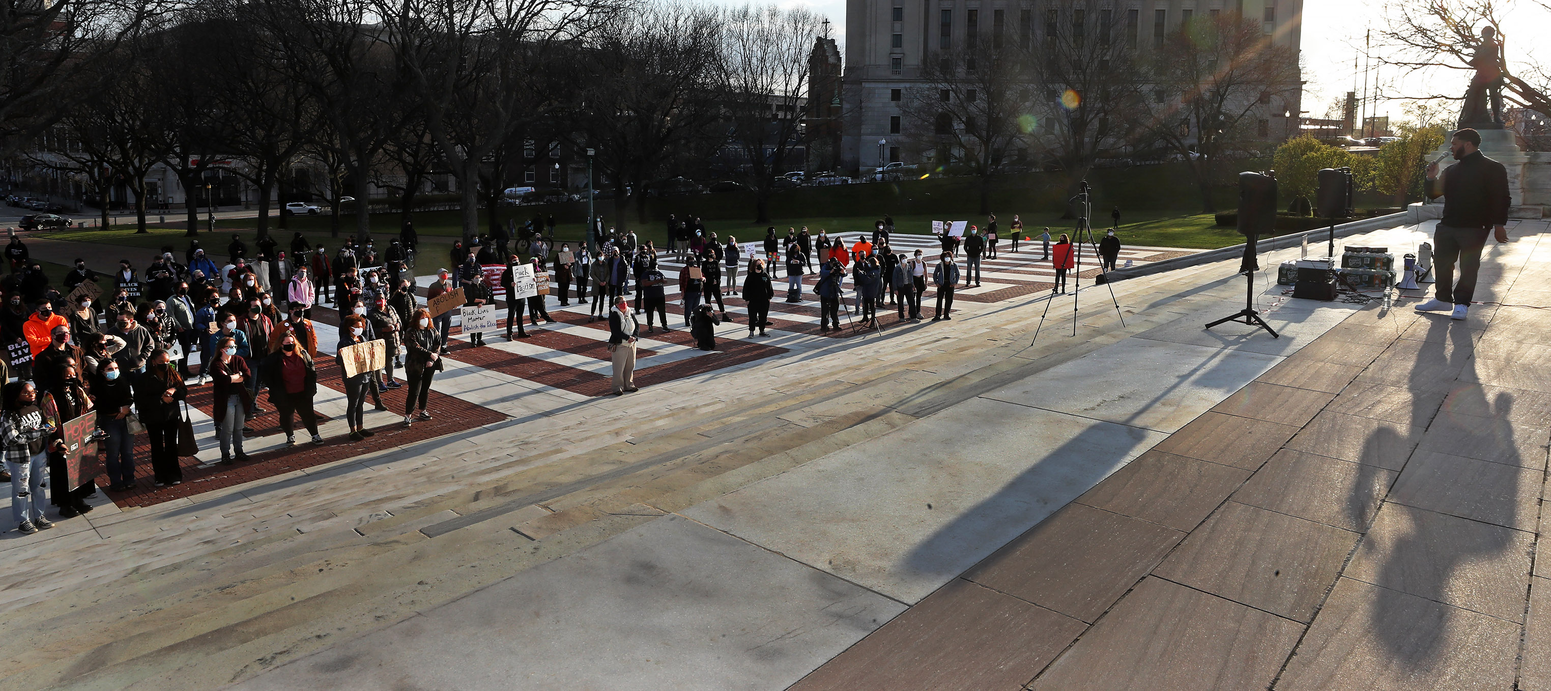 Attendees listen to speakers during a demonstration organized by Black Lives Matter RI PAC and other groups.