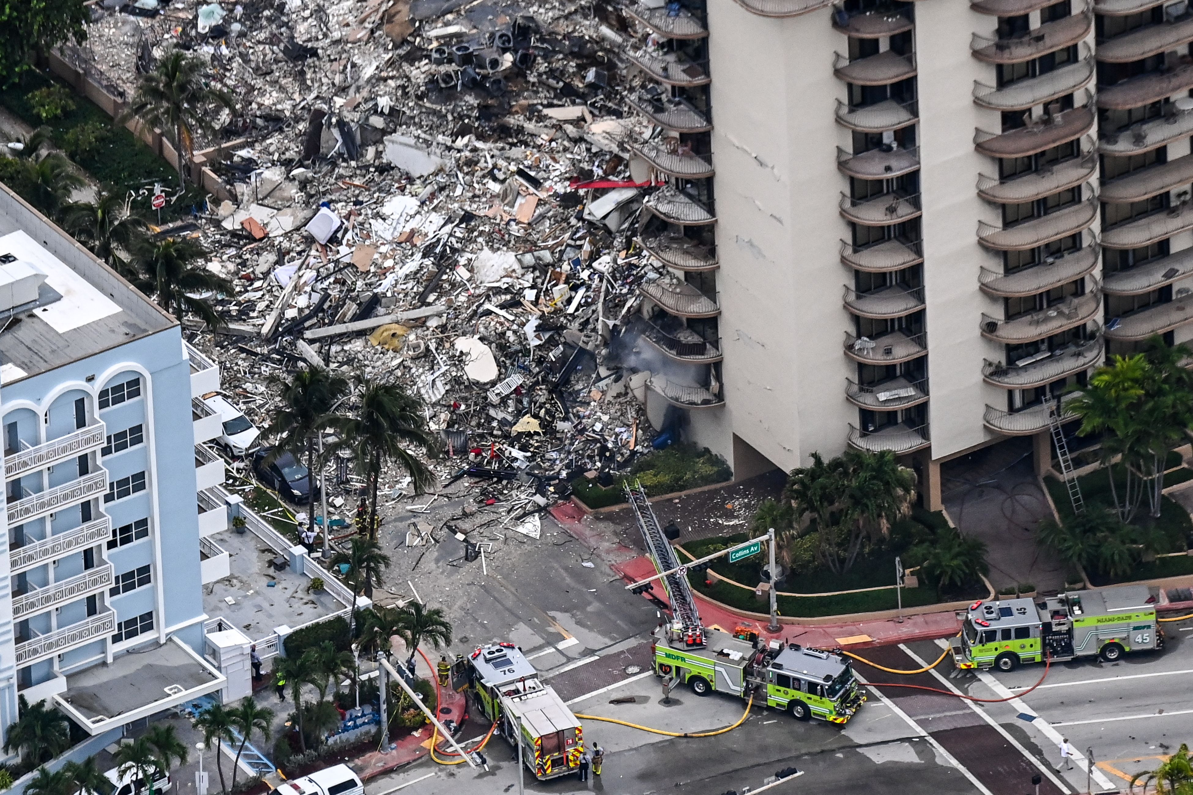 The debris flowed into the street at the collapsed tower.