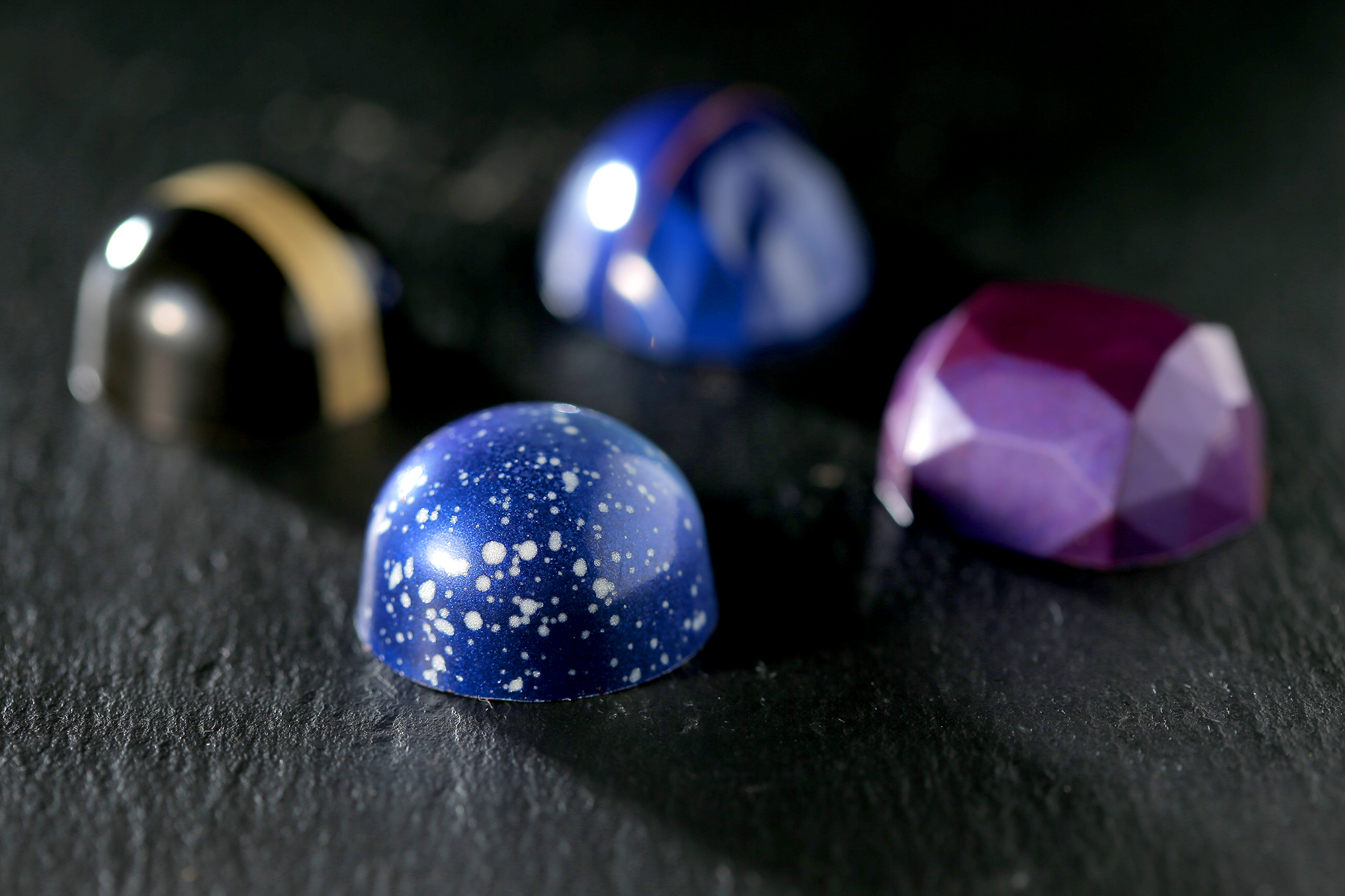 Bonbons Liron Gal decorated by hand, some with brush, and some with airbrush.