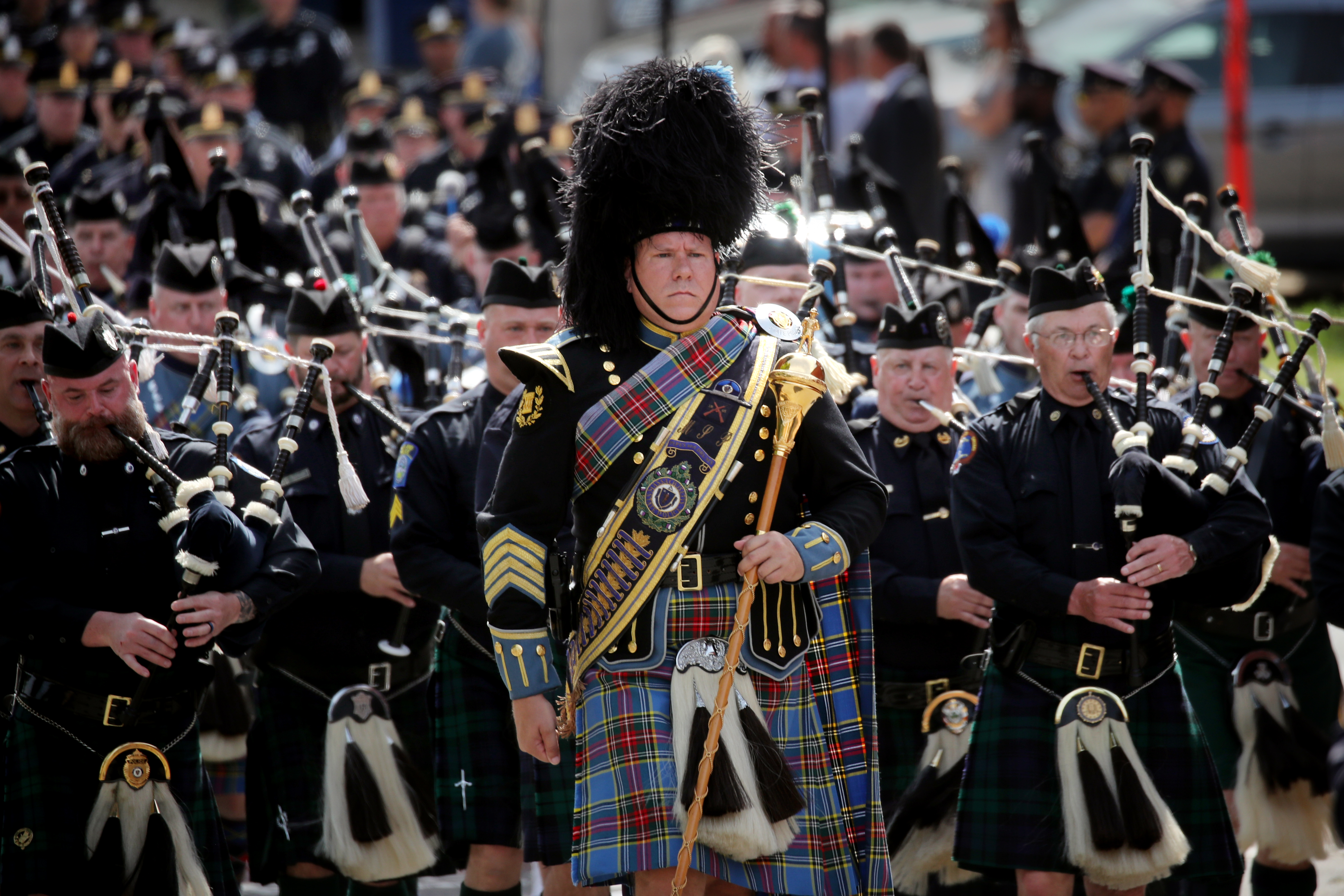 Bagpipers marched in the procession during a funeral service for Worcester Police Officer Enmanuel "Manny" Familia.
