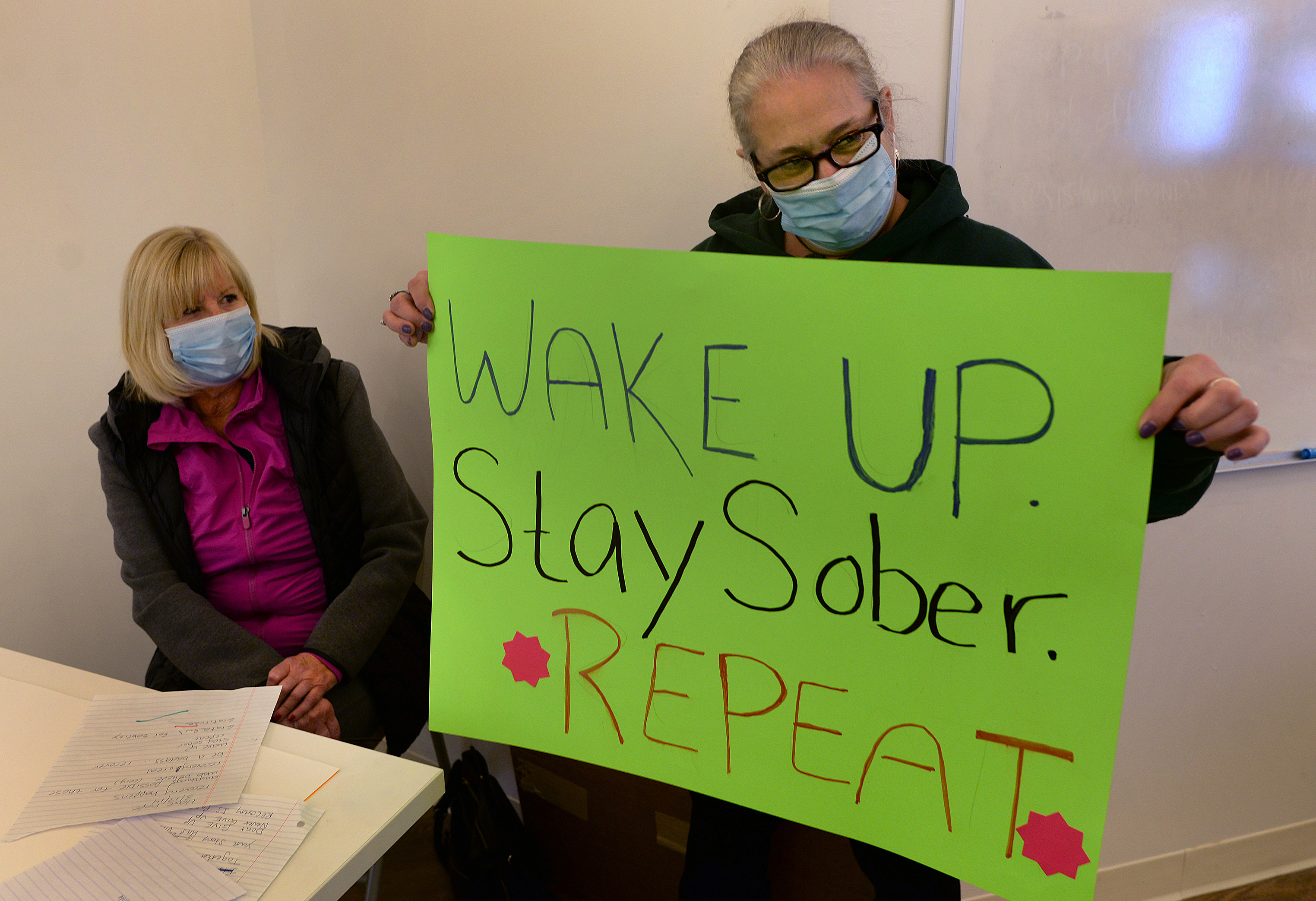Staff from Turniing Point Recovery Support Center make signs to encourage and inspire people on the Walpole town common.