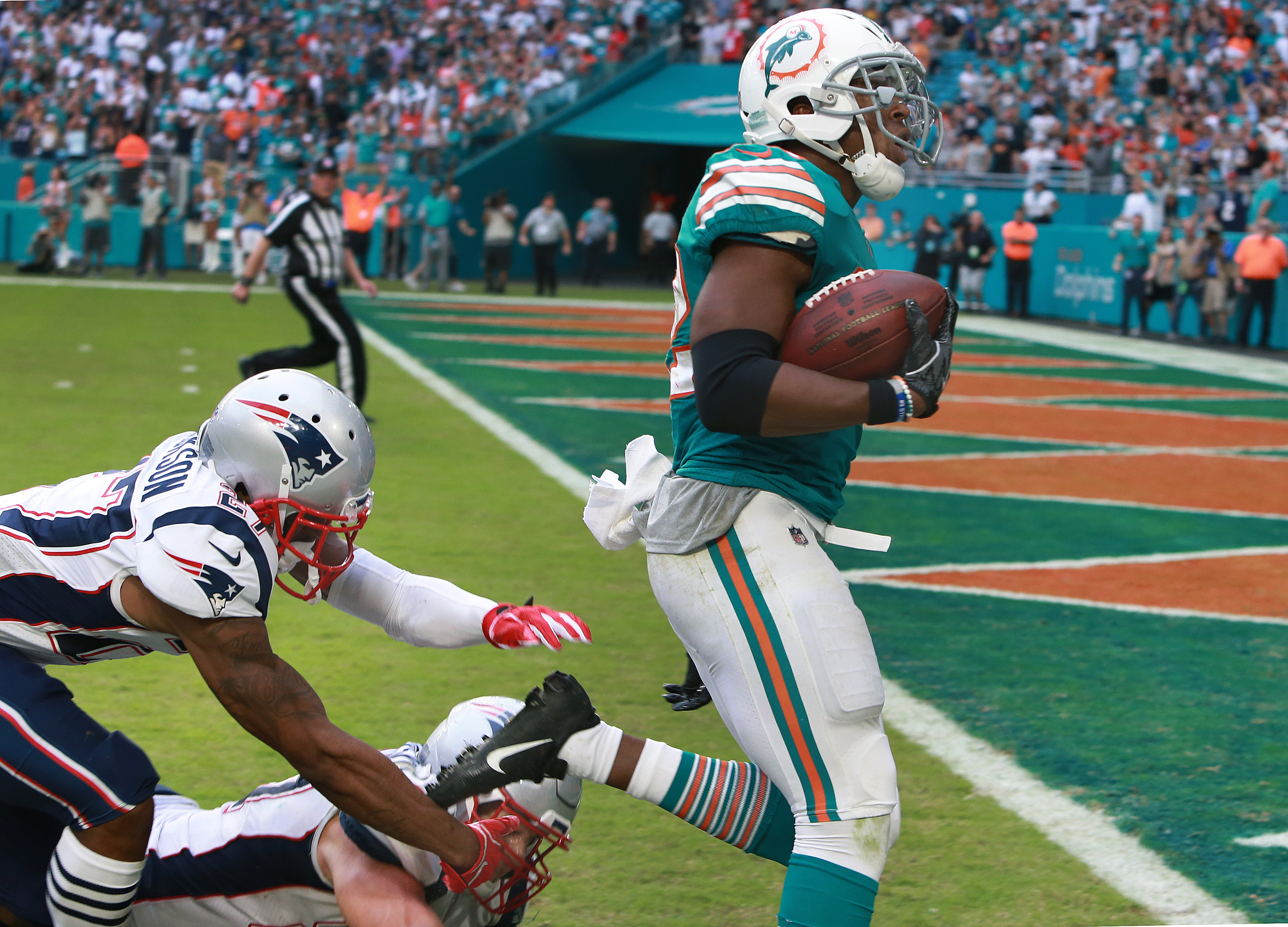 Tom Brady intercepted twice as Miami Dolphins shock New England