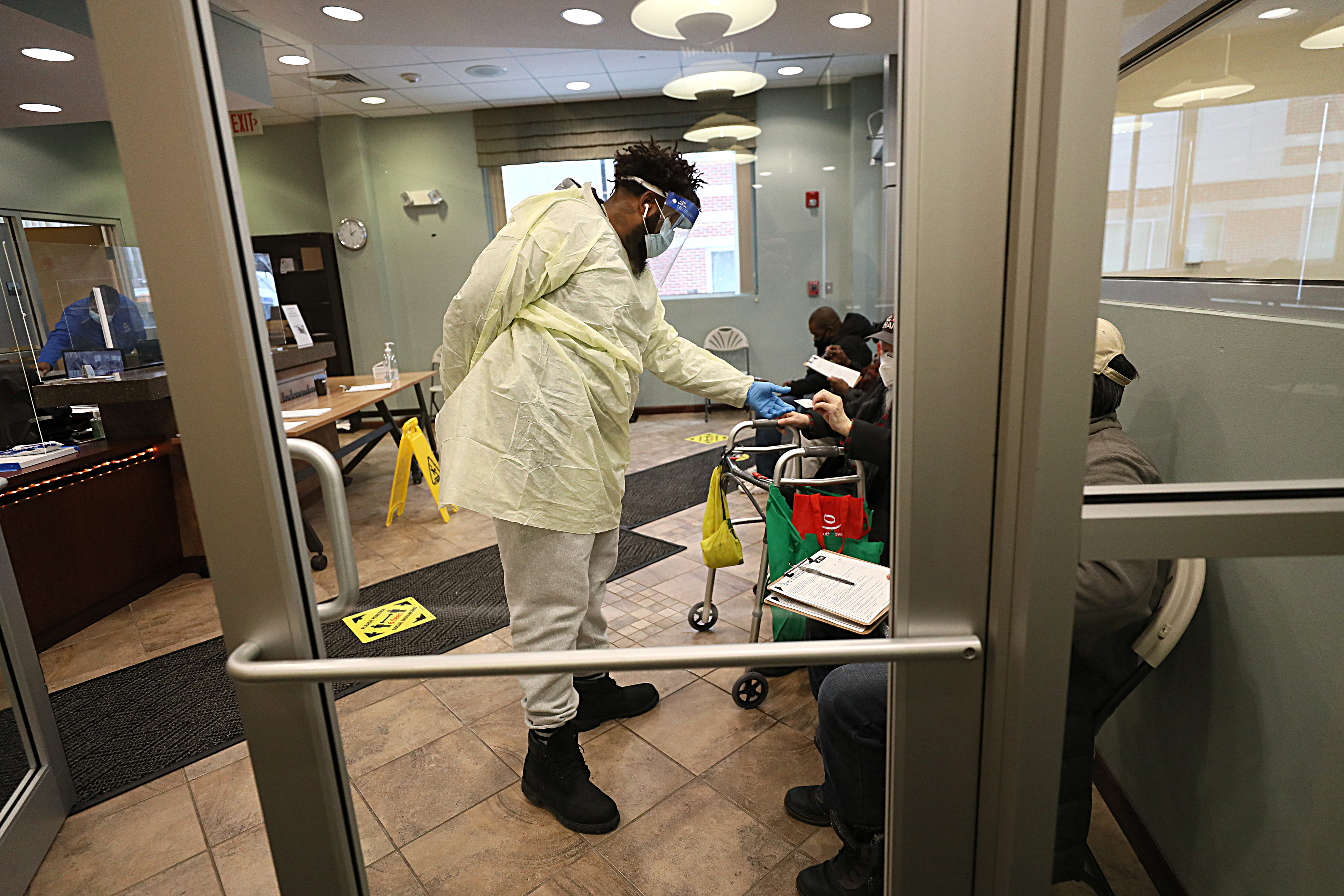 Seniors over 65 gathered in the waiting room of the Central Boston Elder Services Inc. in Roxbury. The vaccine was given out there by the Harvard Street Neighborhood Health Center.