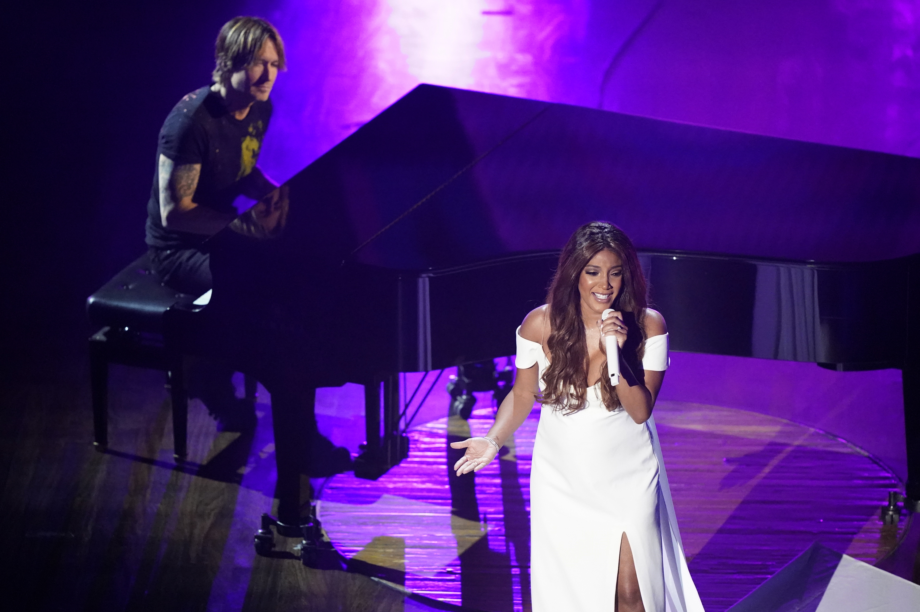 Mickey Guyton, accompanied by Keith Urban, performs at the Academy of Country Music Awards in 2020.