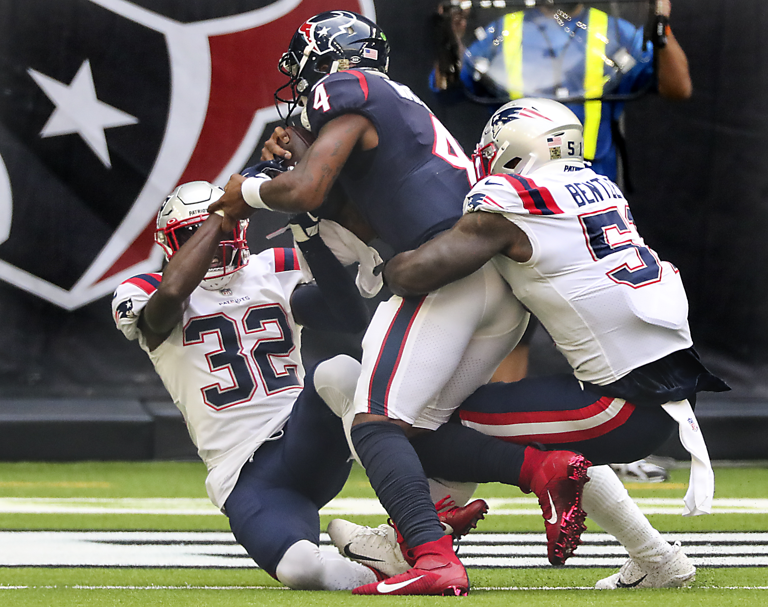 Patriots Devin McCourty (32) and Ja’Whaun Bentley could do nothing to stop Deshaun Watson's 4-yard TD run in the second quarter.