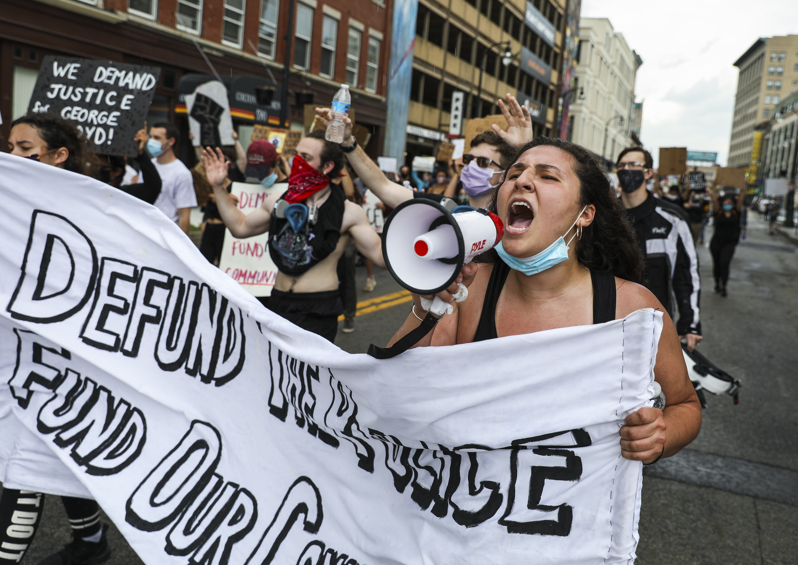 Rally organizer Kaci Panarello led a chant of "no justice, no peace" as she walked with hundreds of demonstrators through the streets of Worcester.