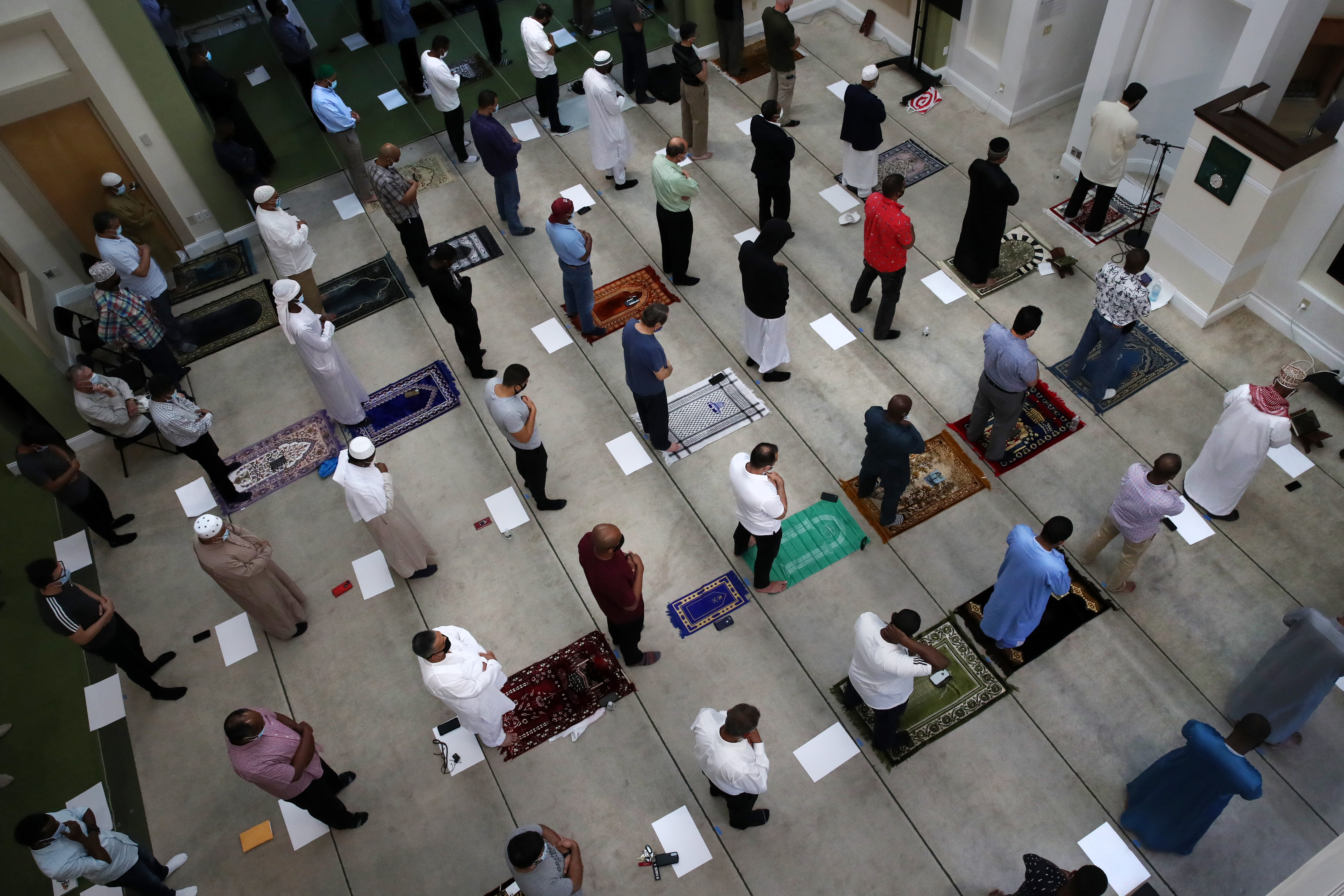 Imam Dr. Asif Hirani leads worshiper during Friday Prayer at the Islamic Society of Boston Cultural Center in Boston on June 18, 2021.