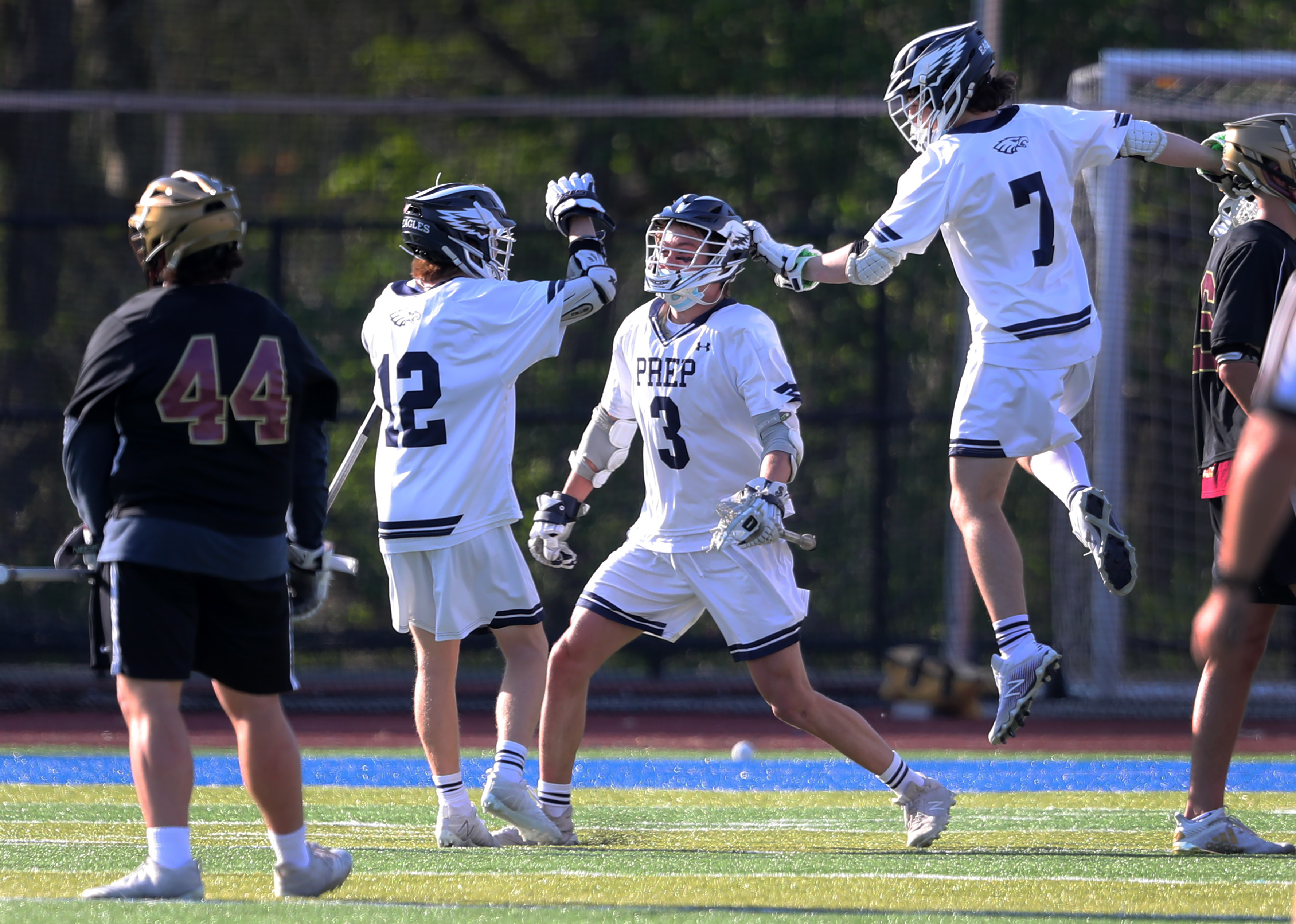 New rules have allowed faceoff specialists such as Graham Tyson (3) of St. John's Prep, who scored a goal Monday against BC High, to get more involved in the offensive play.