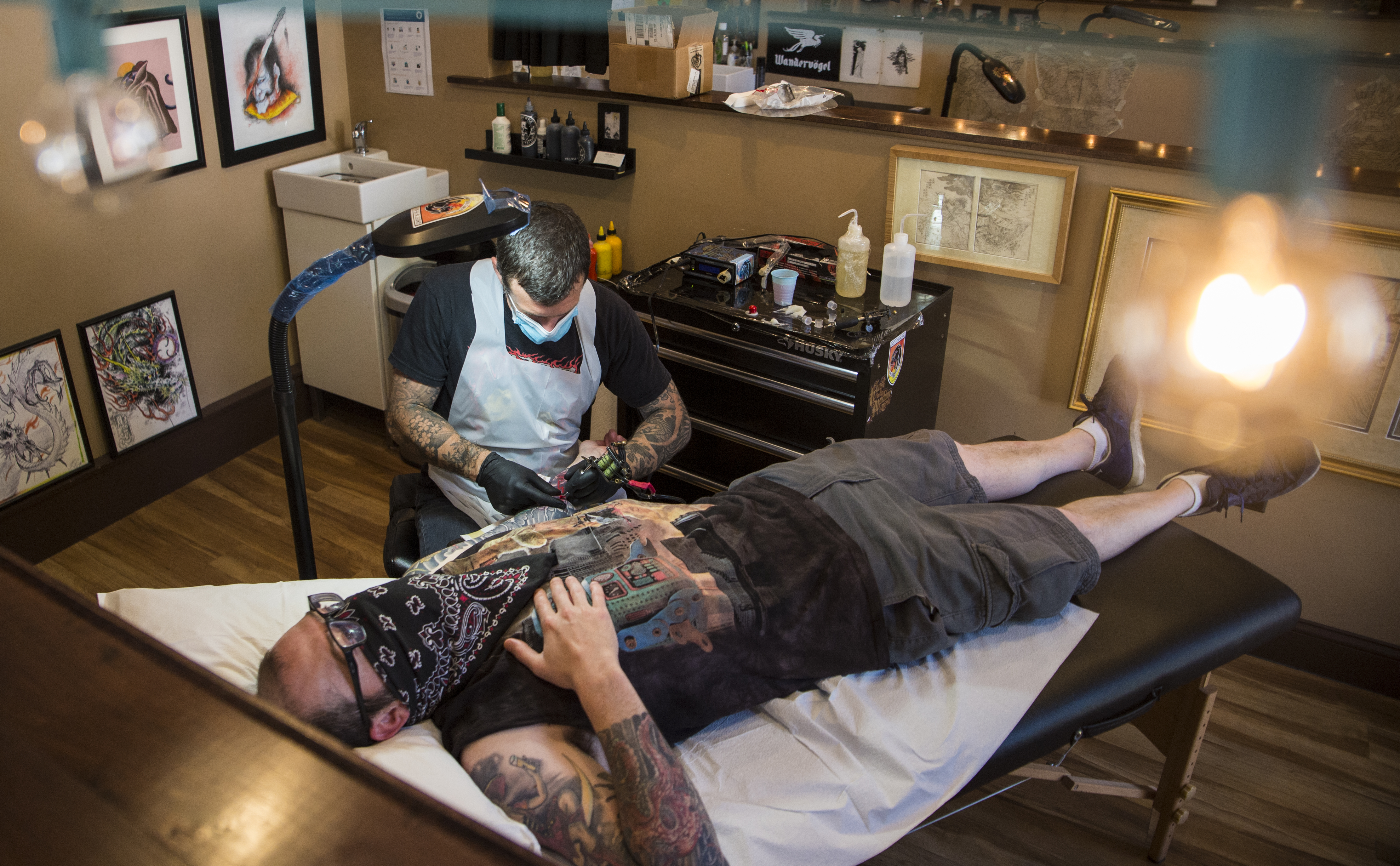 Erik Rieth of the Ghost in the Machine Tattoo in Brighton worked on Ryan Kelly's sleeve on June 22. The tattoo was the first for the shop since the pandemic started and despite a myriad of new restrictions, Rieth said he was just happy to be open again.