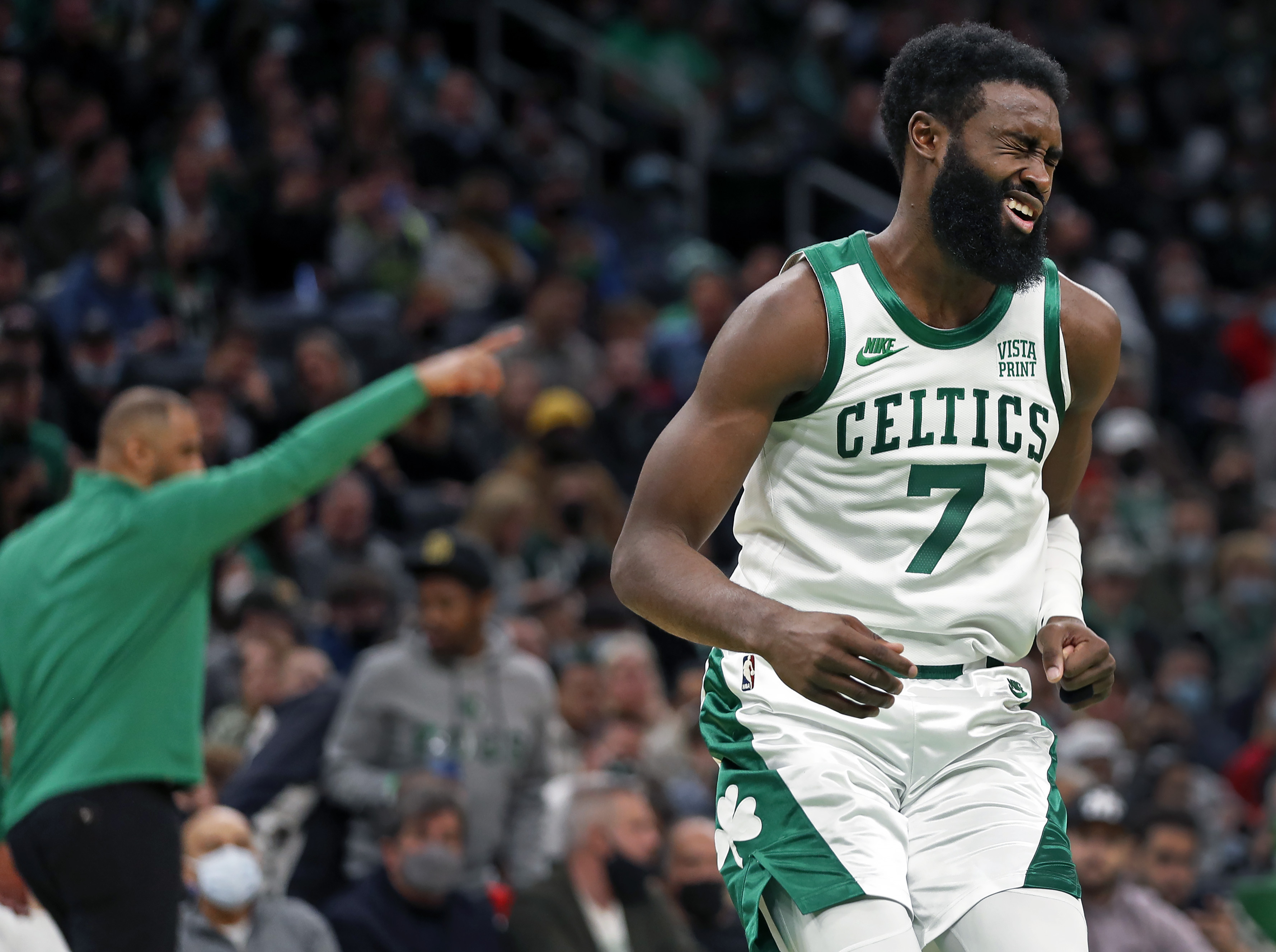 Jaylen Brown grimaces after appearing to get struck in the eye during the second half of Monday's win over Houston.