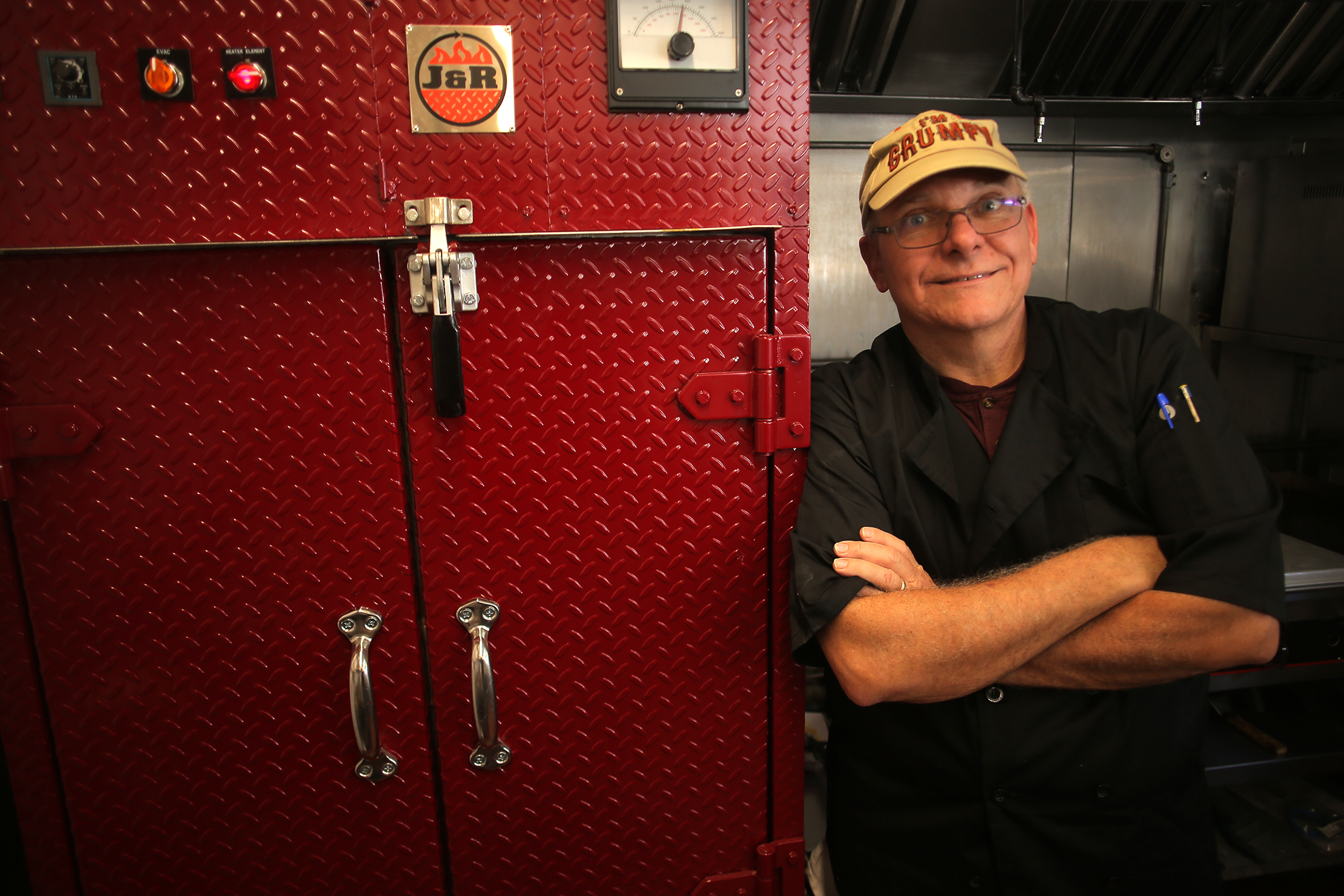DiFelice with his smoker at The Don’s BBQ in Watertown.