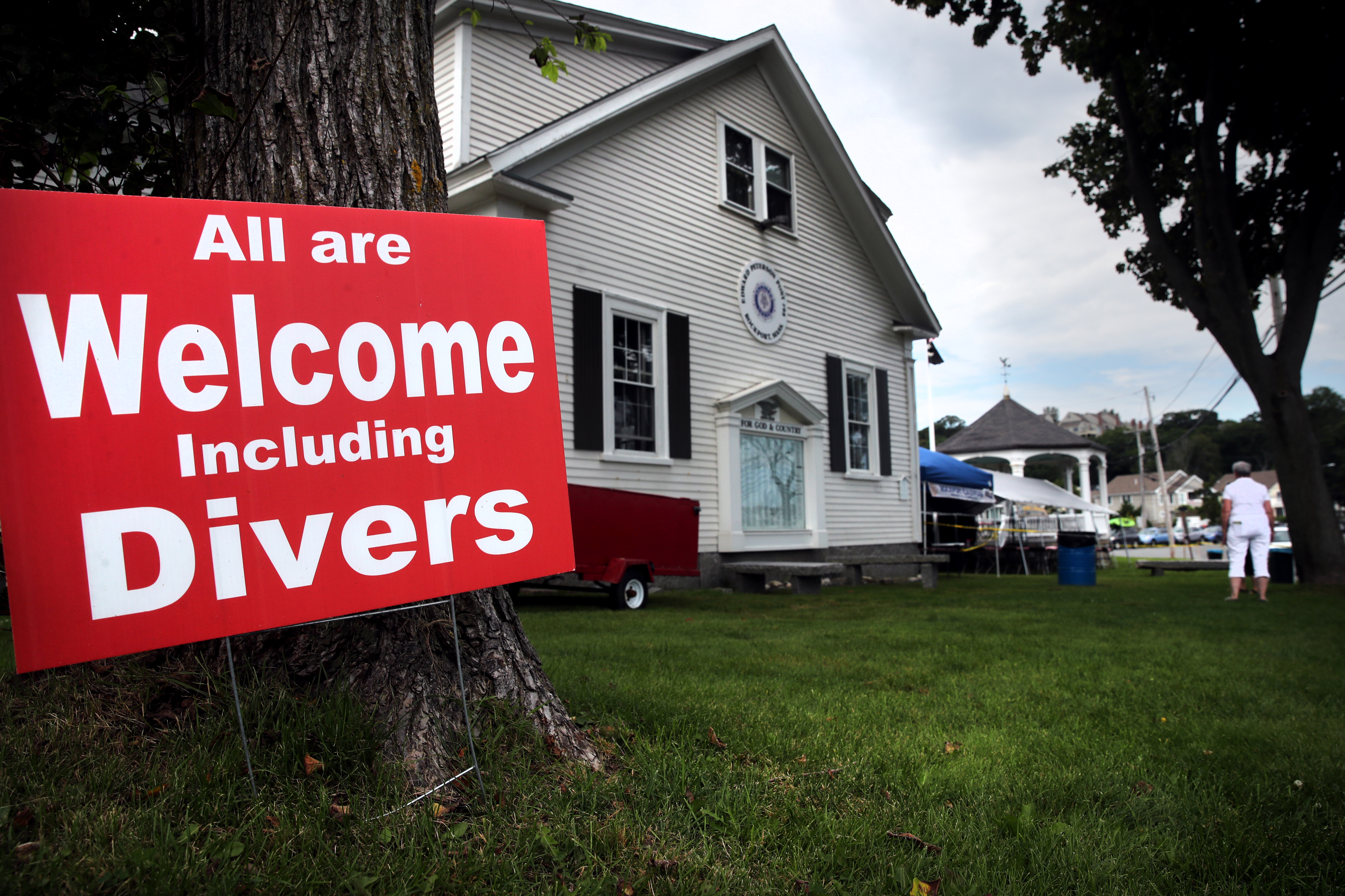 A sign supporting divers sat outside the American Legion Post across the street from Back Beach in Rockport.