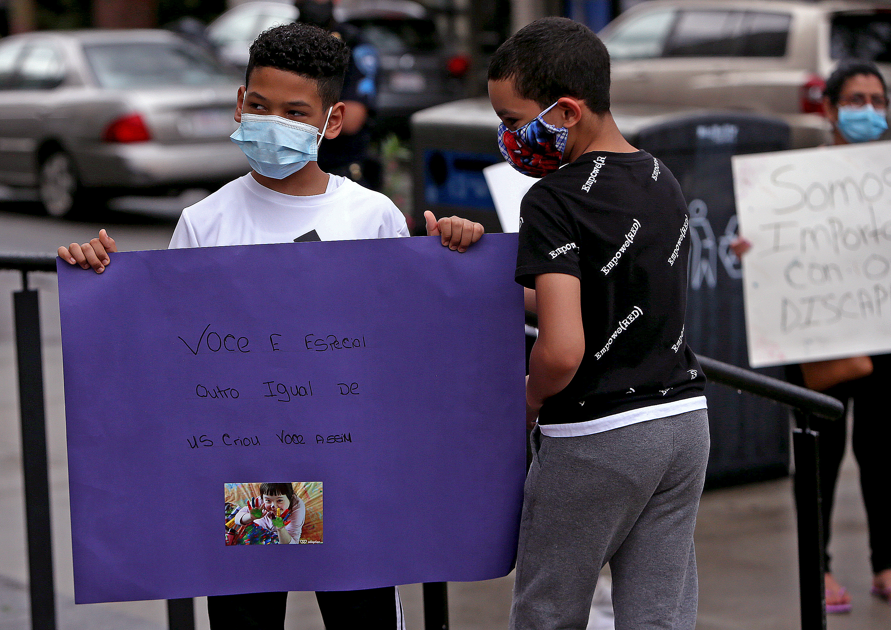 Left to right: Orlando Polanco, 10, and Jensel Cosme, 10, fifth graders at the Blackstone Elementary School, join the protests.