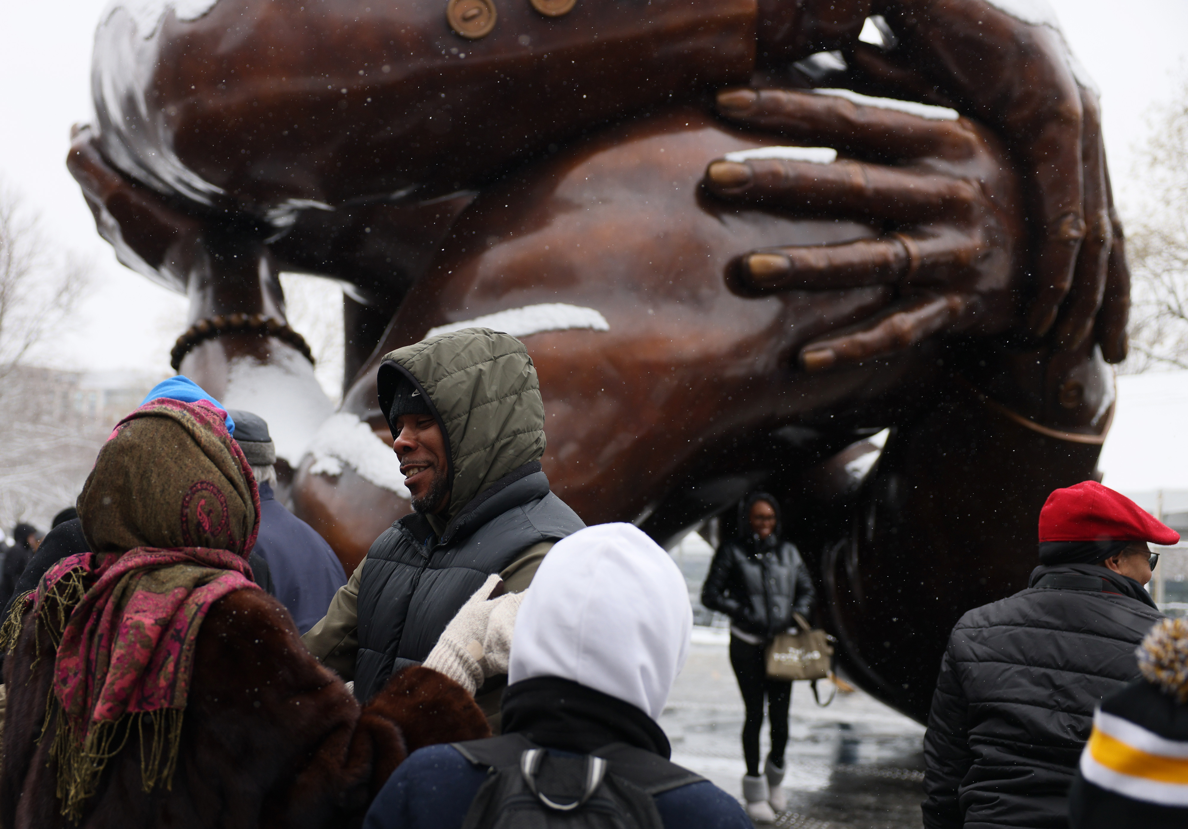 Marveling at 'The Embrace,' Bostonians celebrate a 'superhero' on