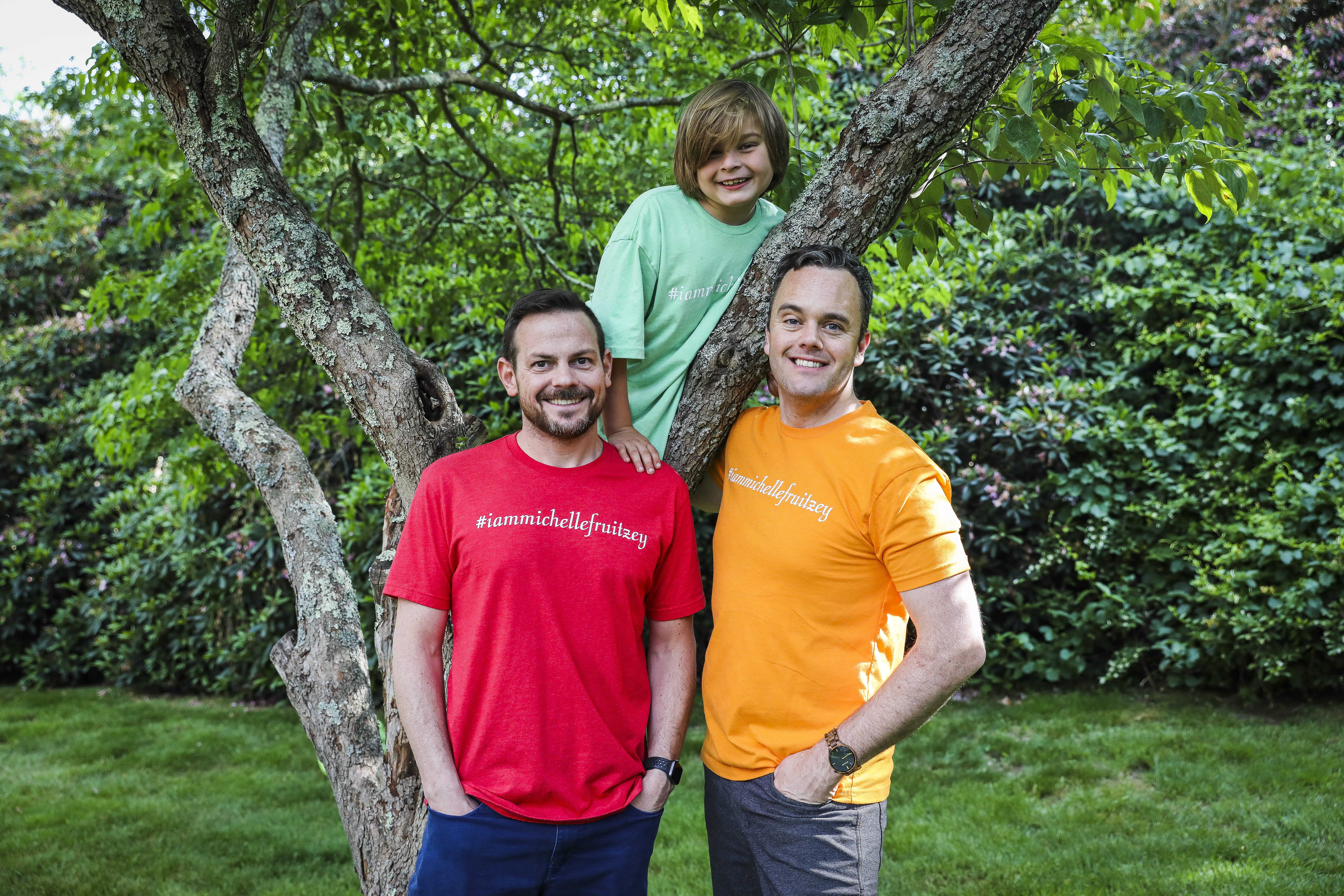 LeeMichael McLean (left), his partner Bryan Furze, and their son Simon at their Milton home.