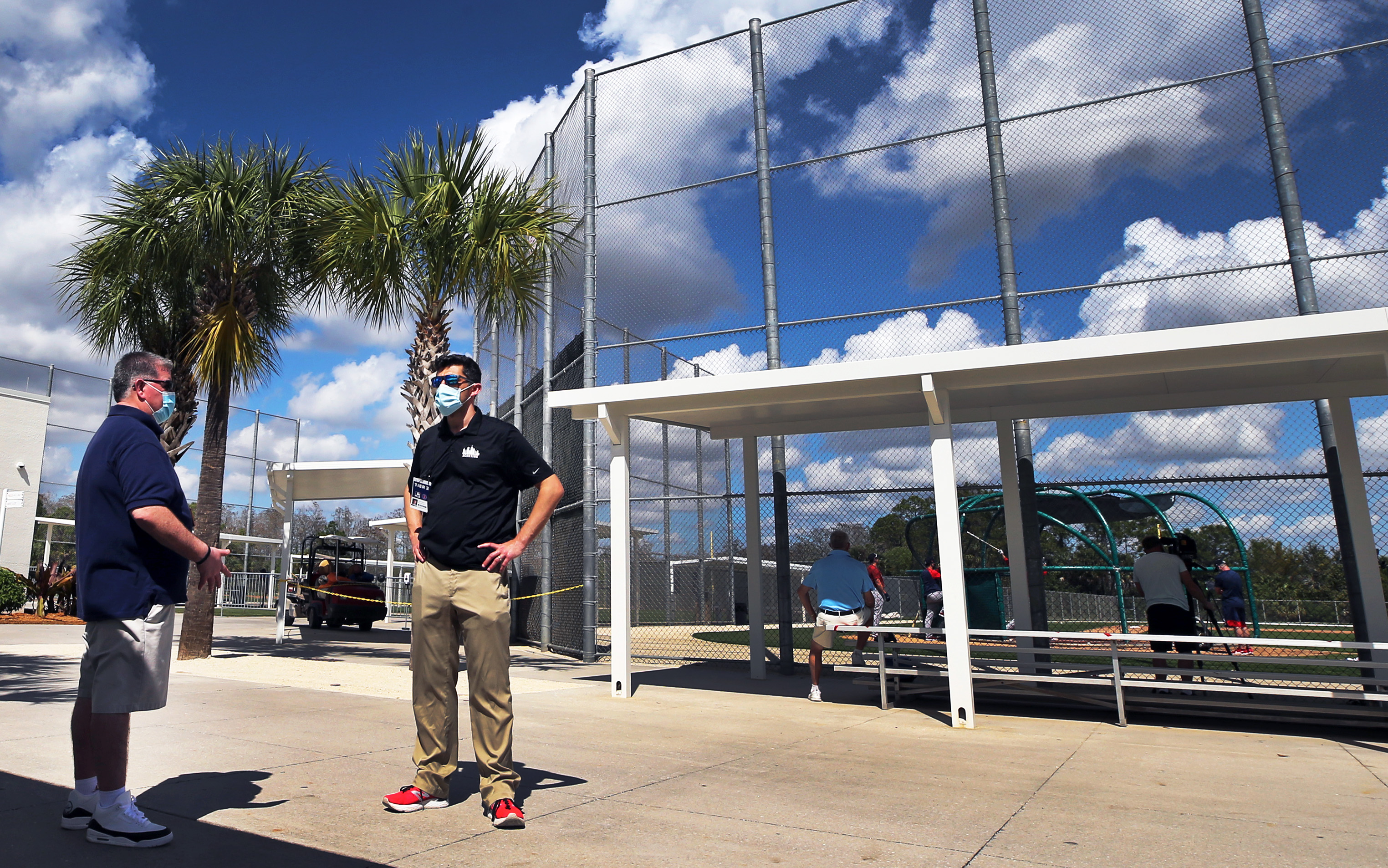 Chaim Bloom (right) and Peter Abraham keep their distance during an interview on Feb. 26 between the practice fields at the JetBlue Park complex.