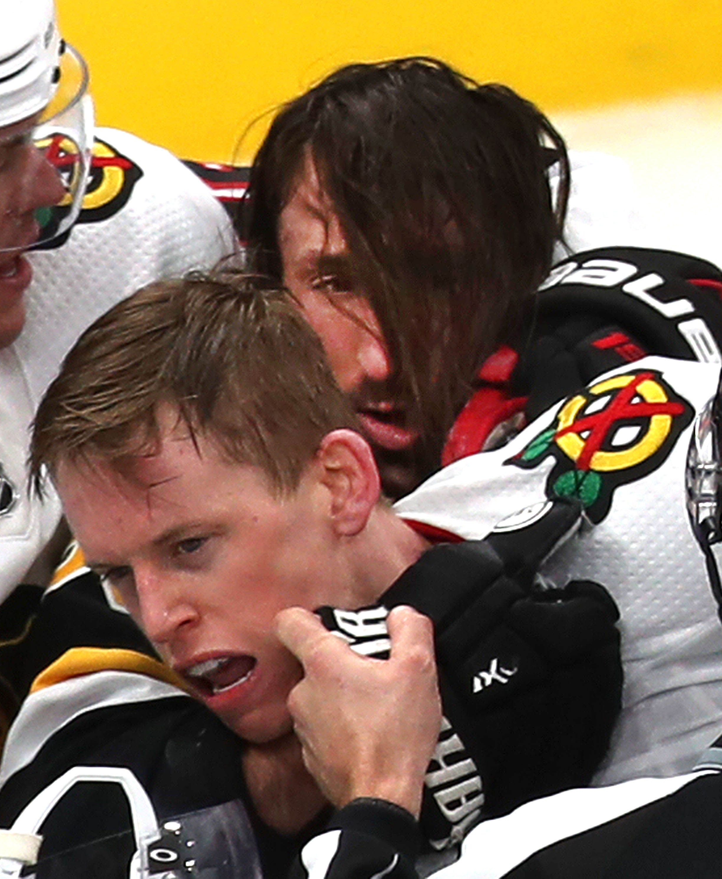 Bruins forward Brad Marchand found his face a little obscured by his hair during a tussle with Chicago’s Connor Murphy in the second period of Chicago’s 4-3 win over the Bruins on Dec. 5 at TD Garden.