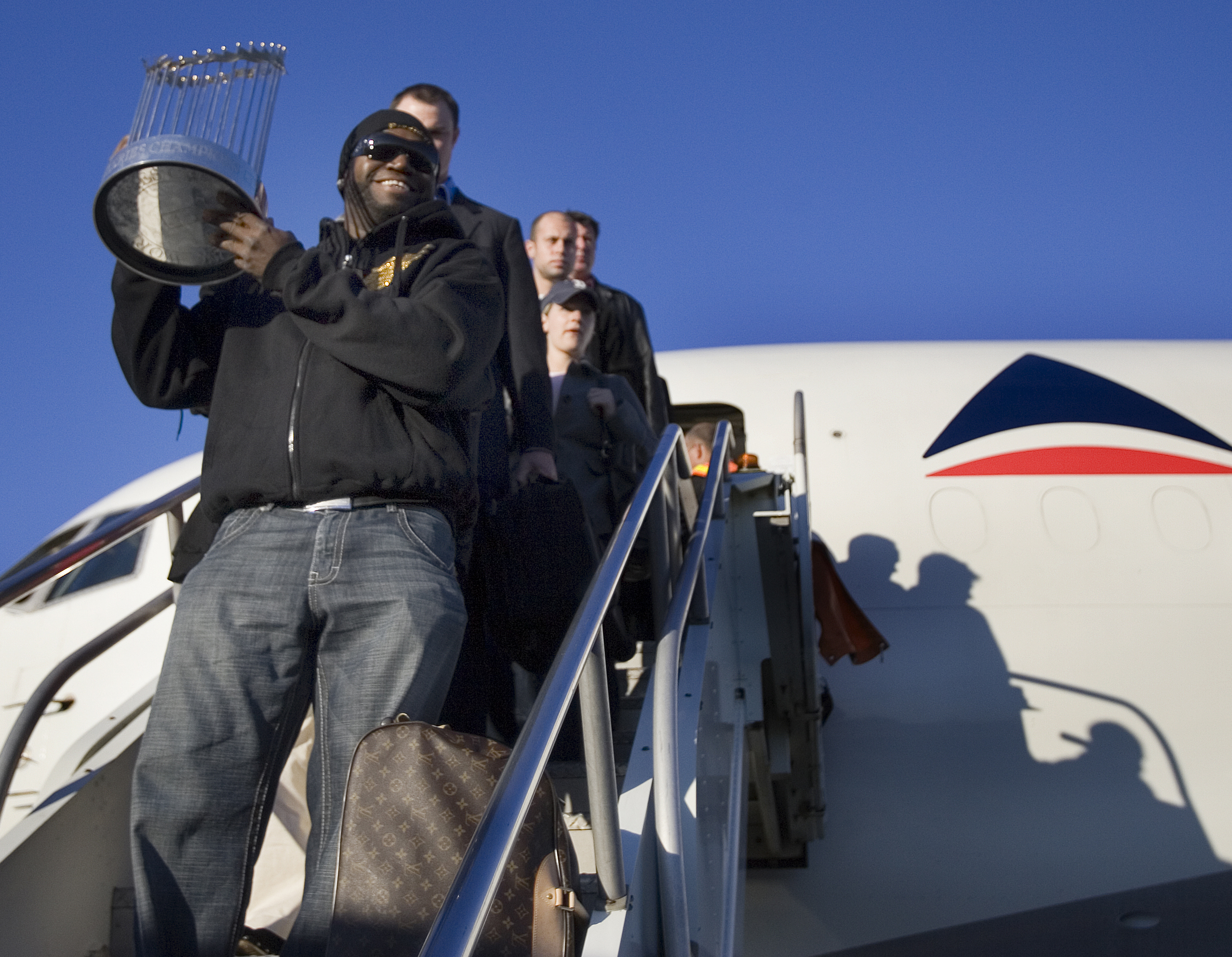 The Red Sox won the Series in Denver Oct. 28, and flew back to Boston the next day. Ortiz had the privilege of carrying the trophy onto the tarmac at Logan.