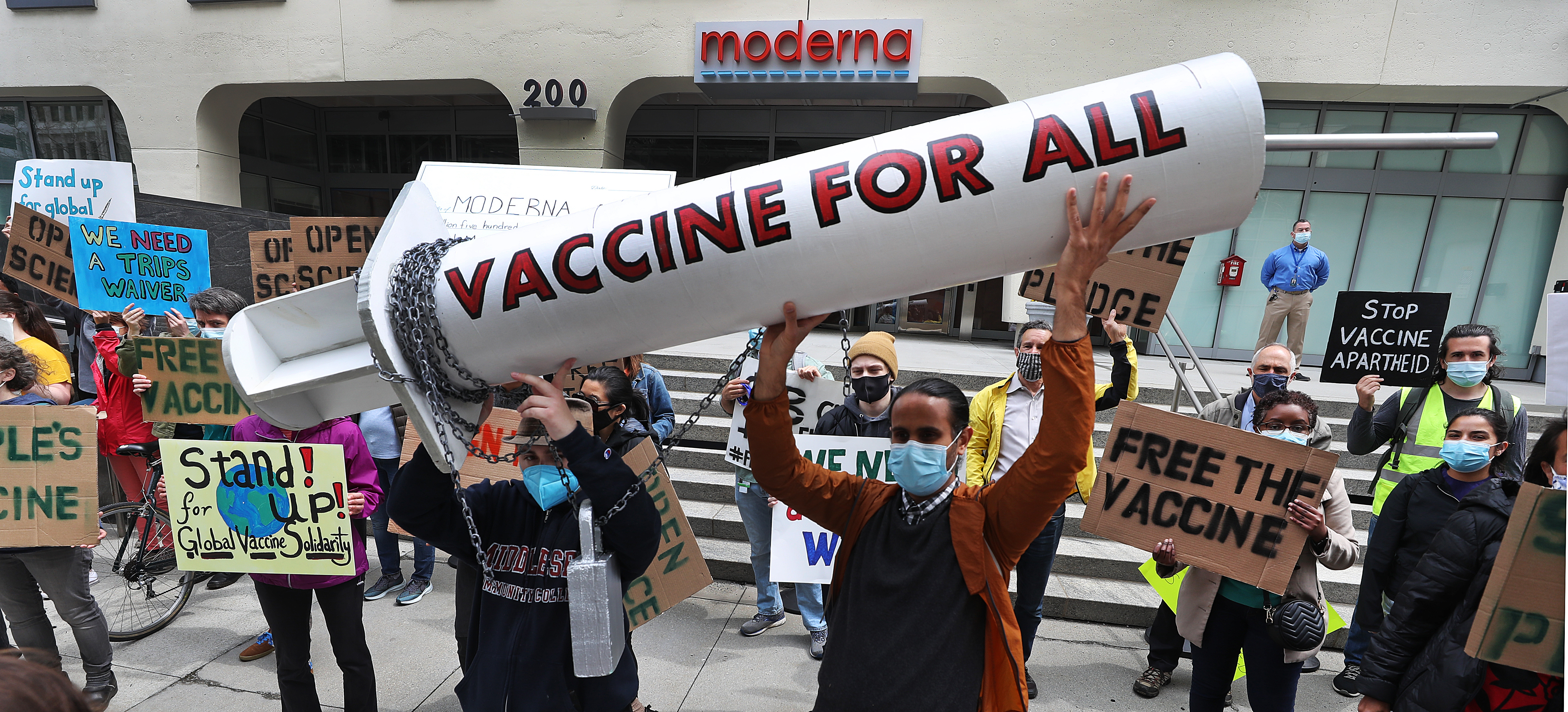 Protesters at Moderna's Cambridge headquarters call for vaccine ...