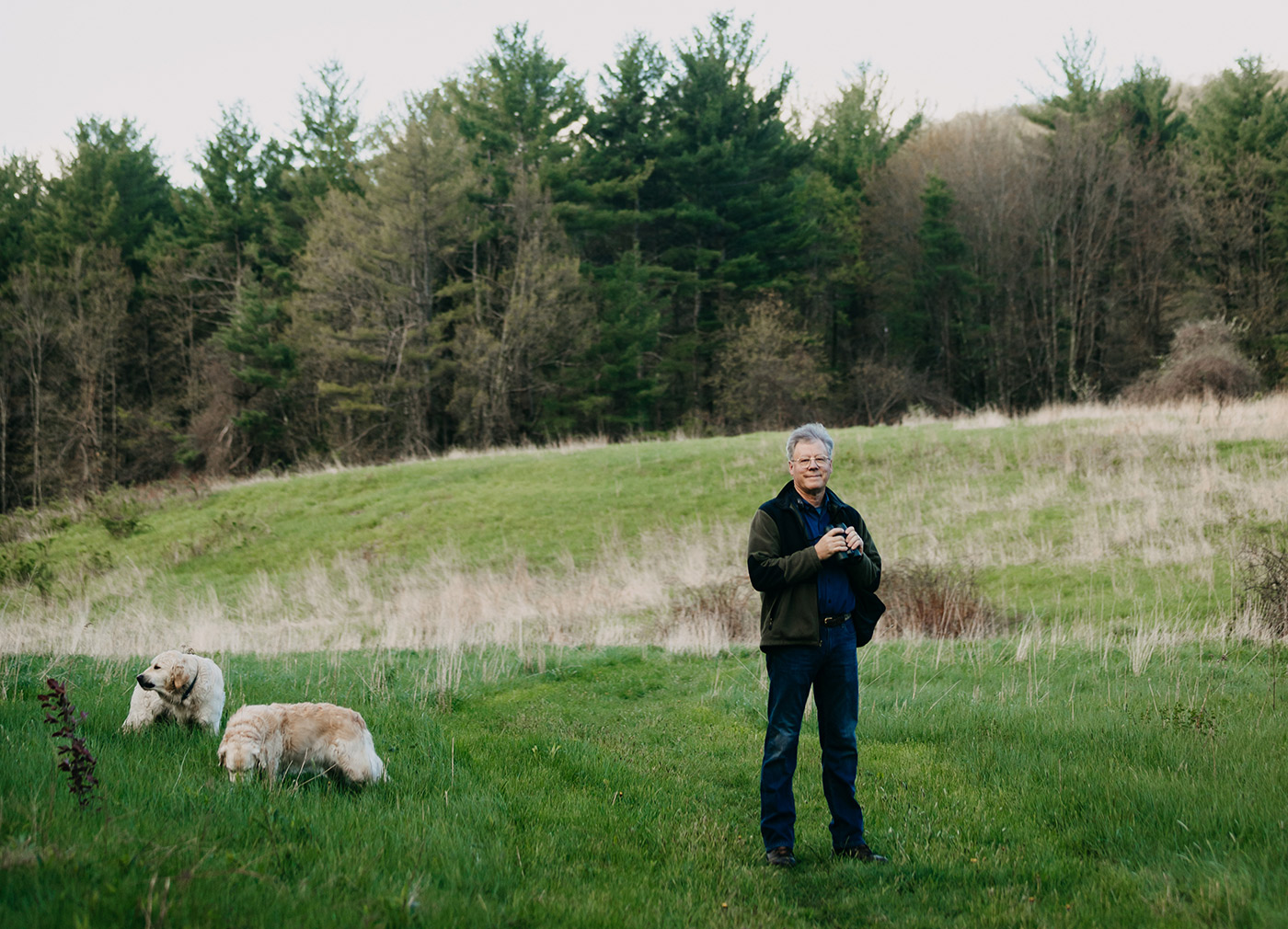 Sibley and his dogs near his home in Deerfield.