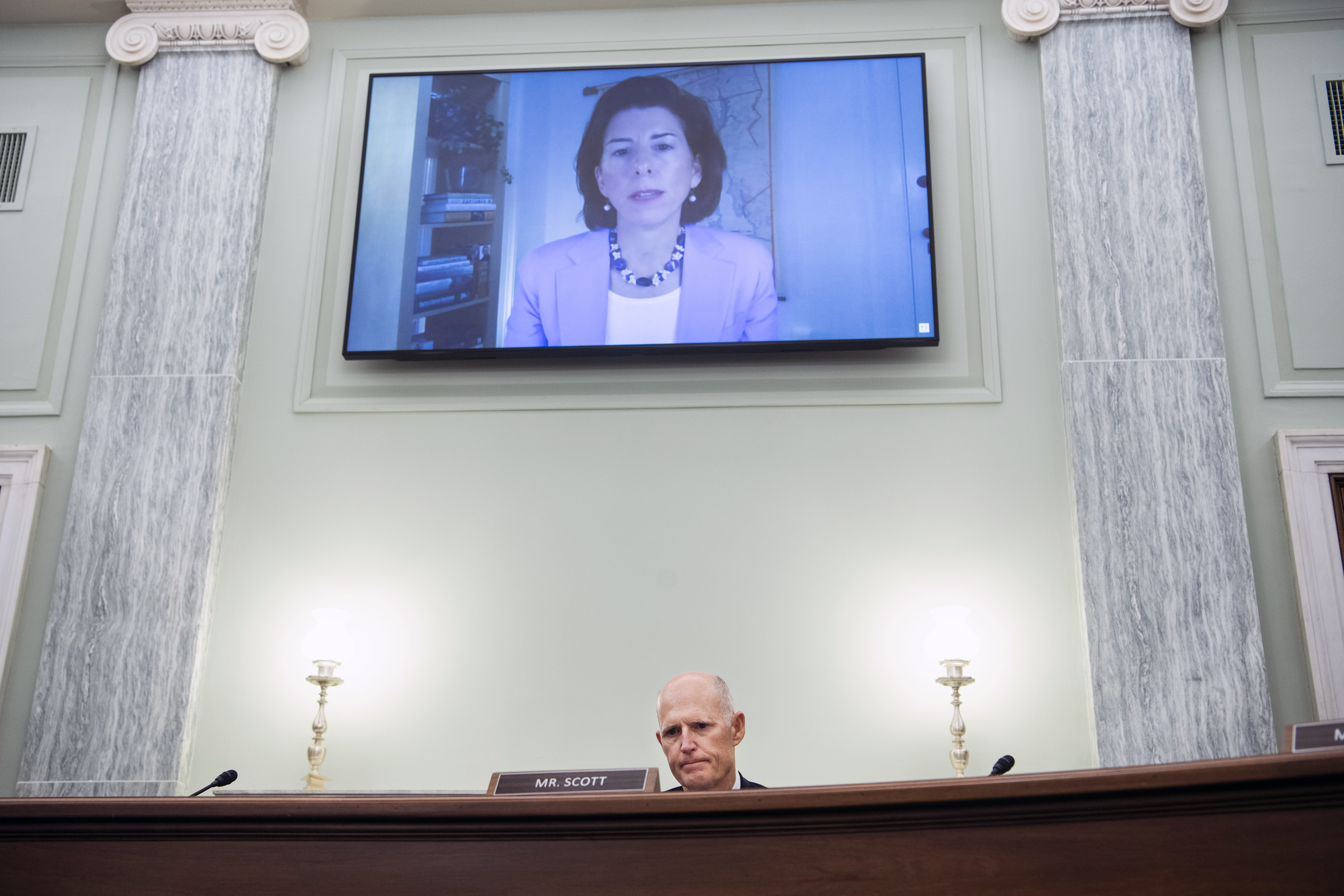 Republican Senator Rick Scott of Florida questions Rhode Island Governor Gina Raimondo, the nominee for Secretary of Commerce, during her Senate Commerce, Science, and Transportation Committee confirmation hearing,Jan. 26, 2021, on Capitol Hill in Washington.