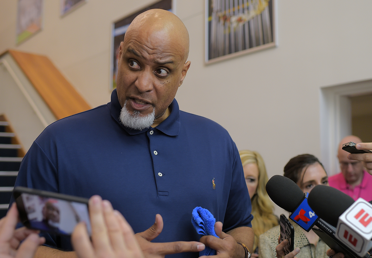 Players union chief Tony Clark speaks with reporters earlier this spring.