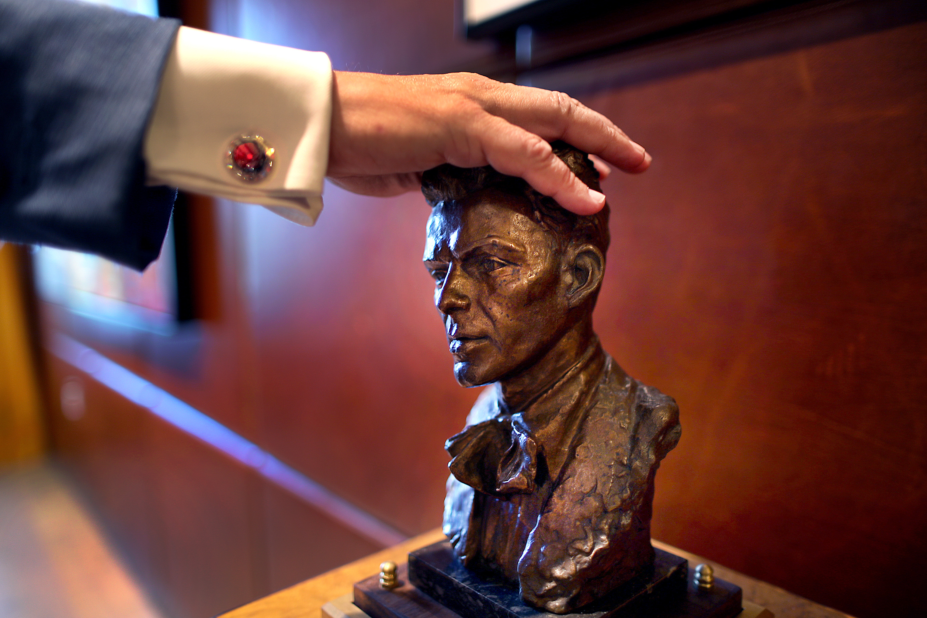Paul Edgerley pressed a bust of Frank Sinatra to open the hideaway room door.