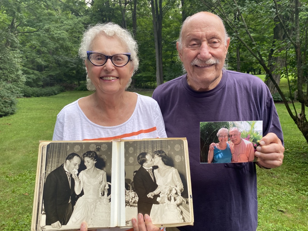 Elaine and Arthur Greenberg with their wedding photos and a photo from the 1990s.