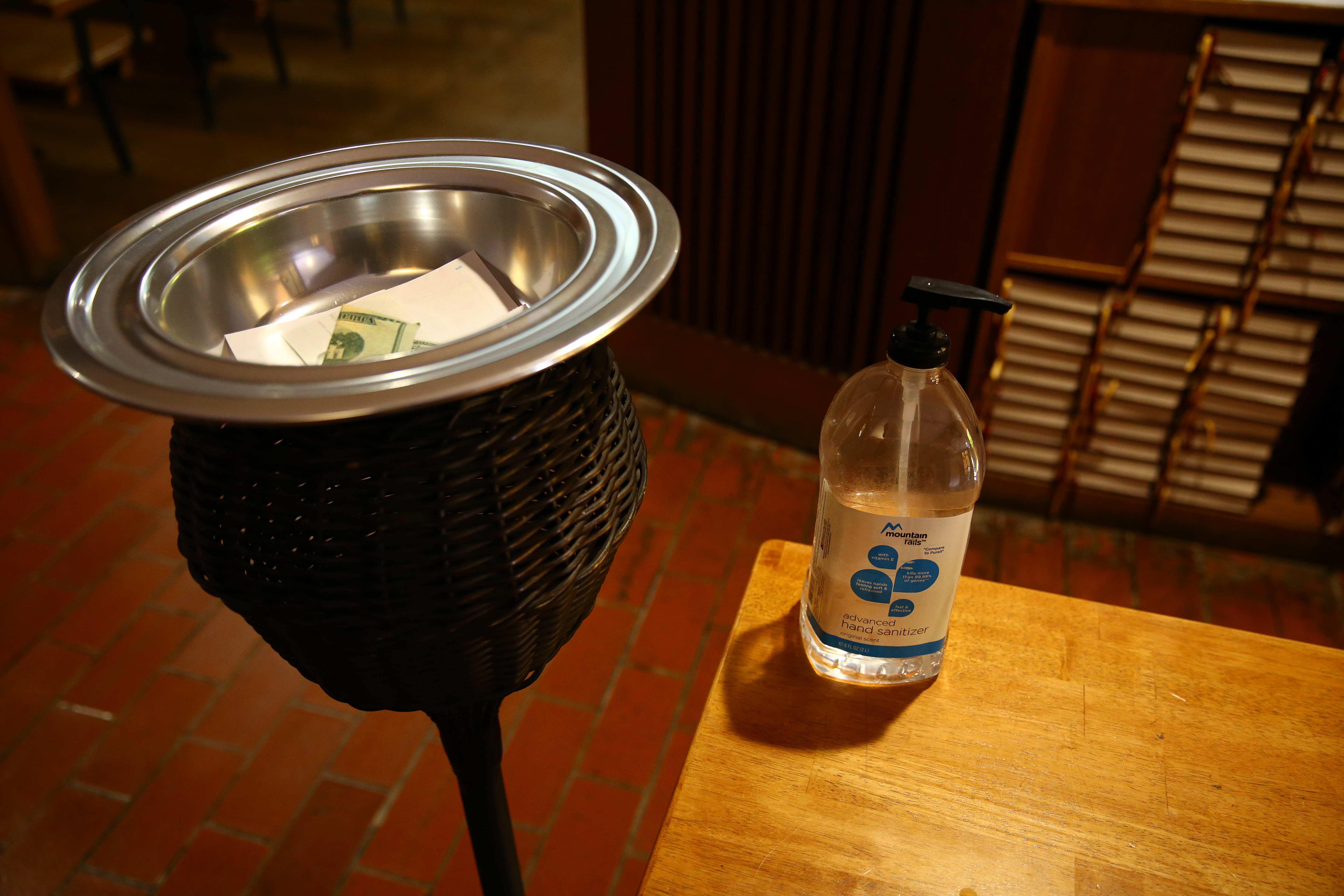 Next to the collection plate was a large bottle of hand sanitizer. Those attending this service in First Lutheran Church made reservations to attend.