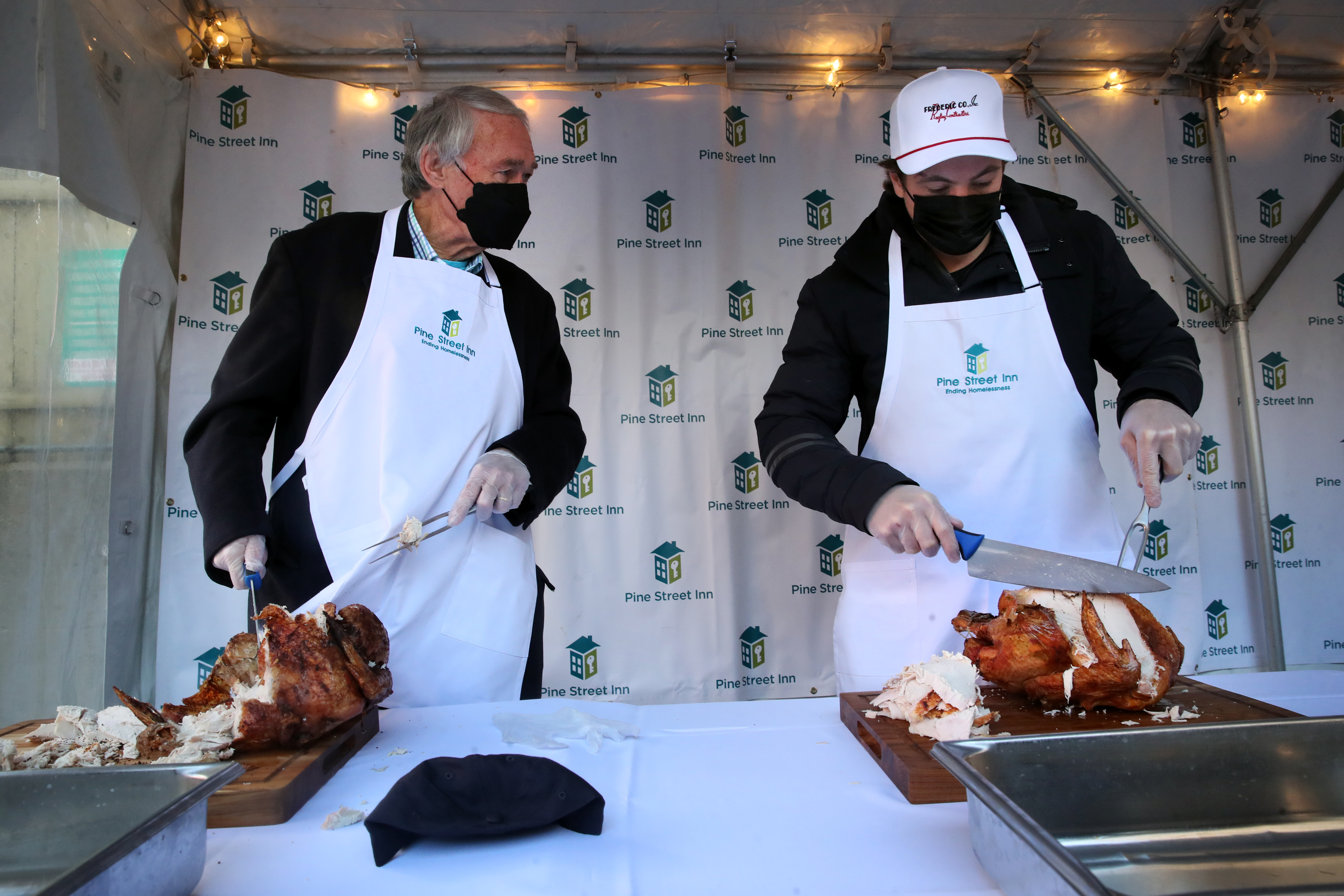 Senator Edward J. Markey and Boston Bruins defenseman Charlie McAvoy carved turkeys to be served to guests at the Pine Street Inn in Boston on Thanksgiving.