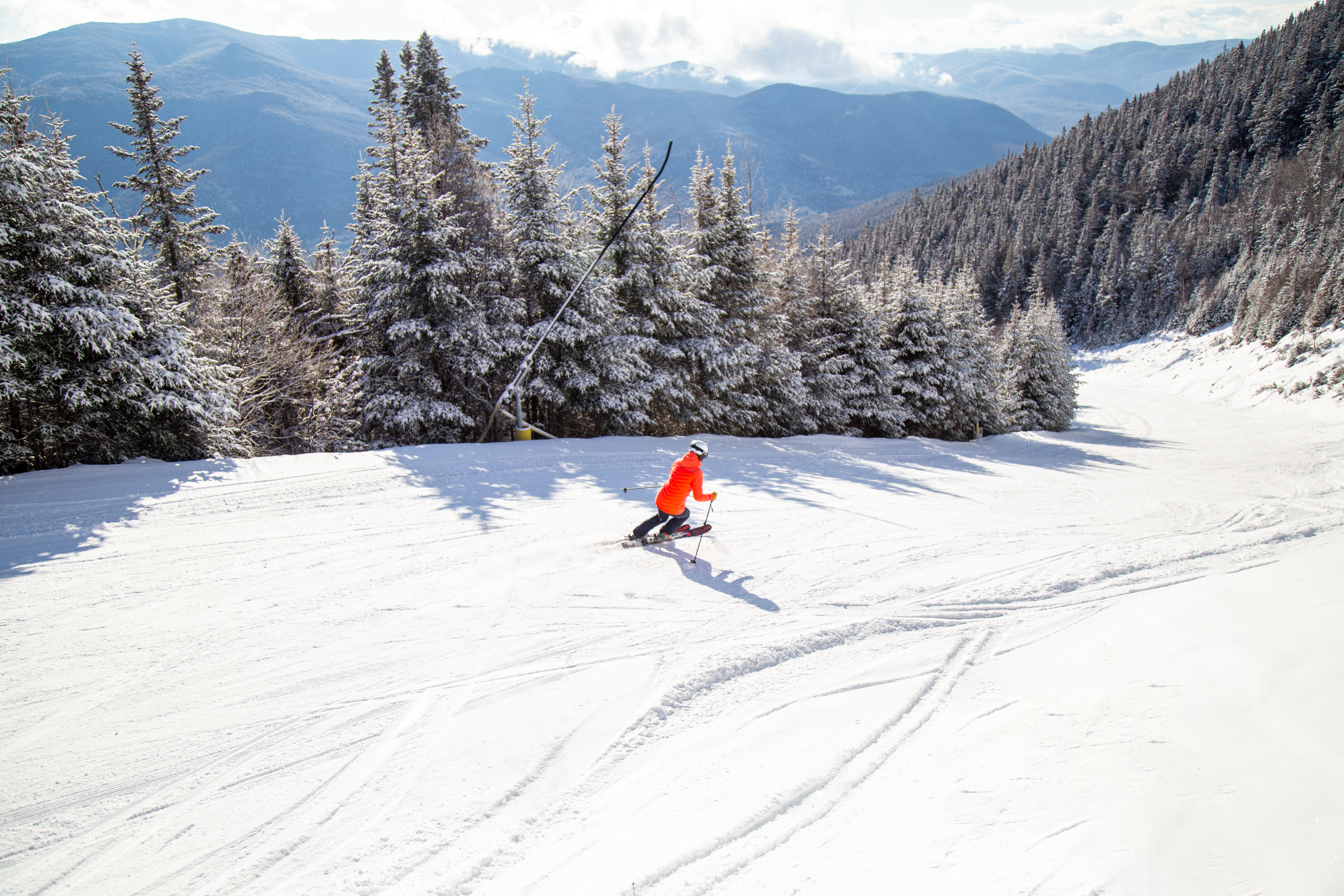 A skier heading downhill at Waterville Valley in New Hampshire.