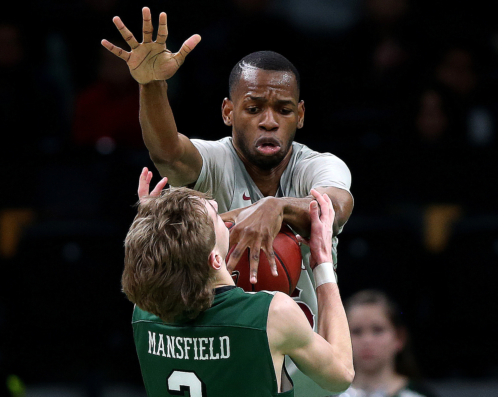 Lynn English’s Jean-Baptiste Mukeba went for a block on the shot by Mansfield’s Matthew Been in the Division 1 boys’ basketball semifinal at TD Garden on March 10.