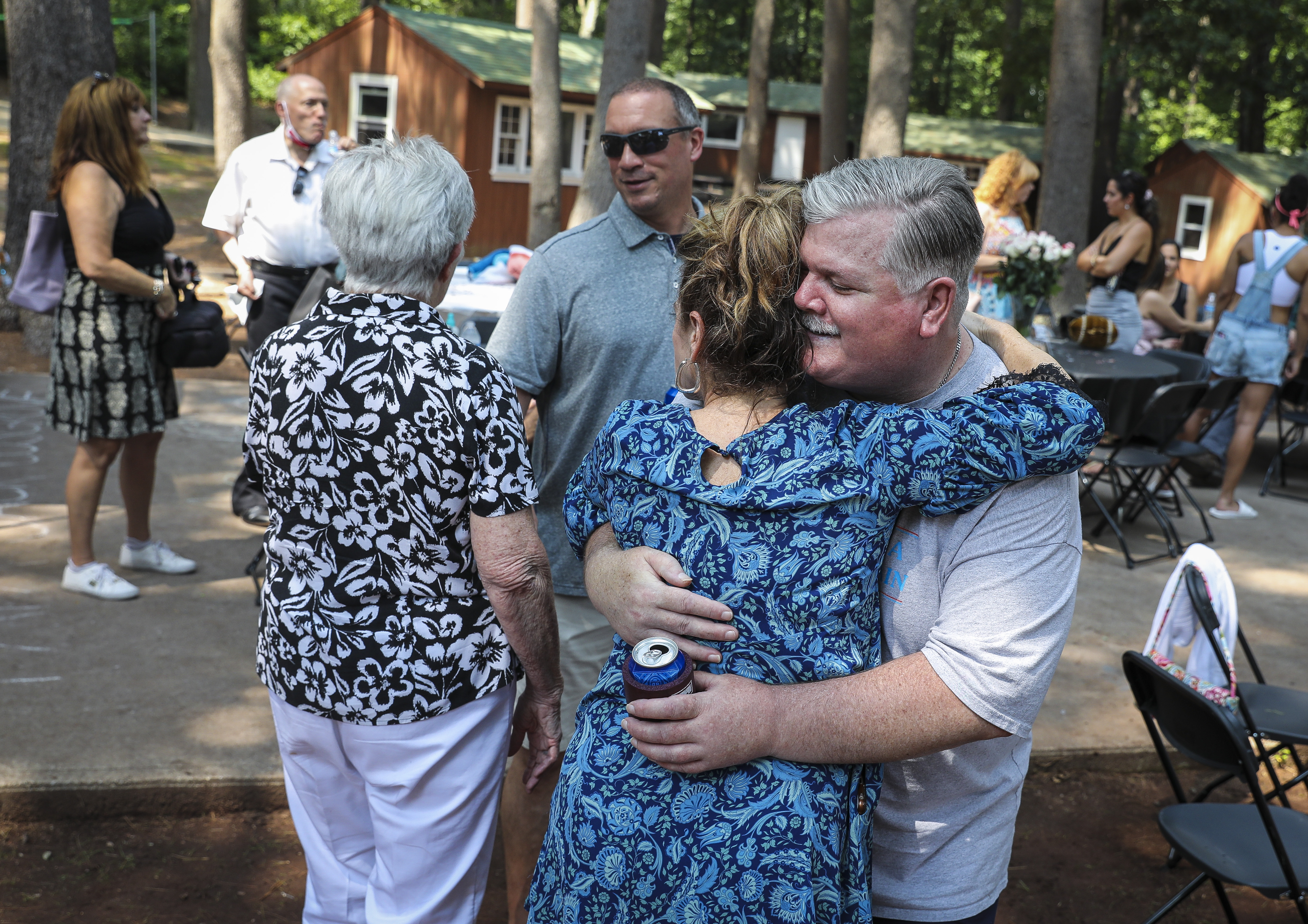 Jeffrey Cosgrove embraces long-time friend Pam Cronin, who grew up in his family’s neighborhood.