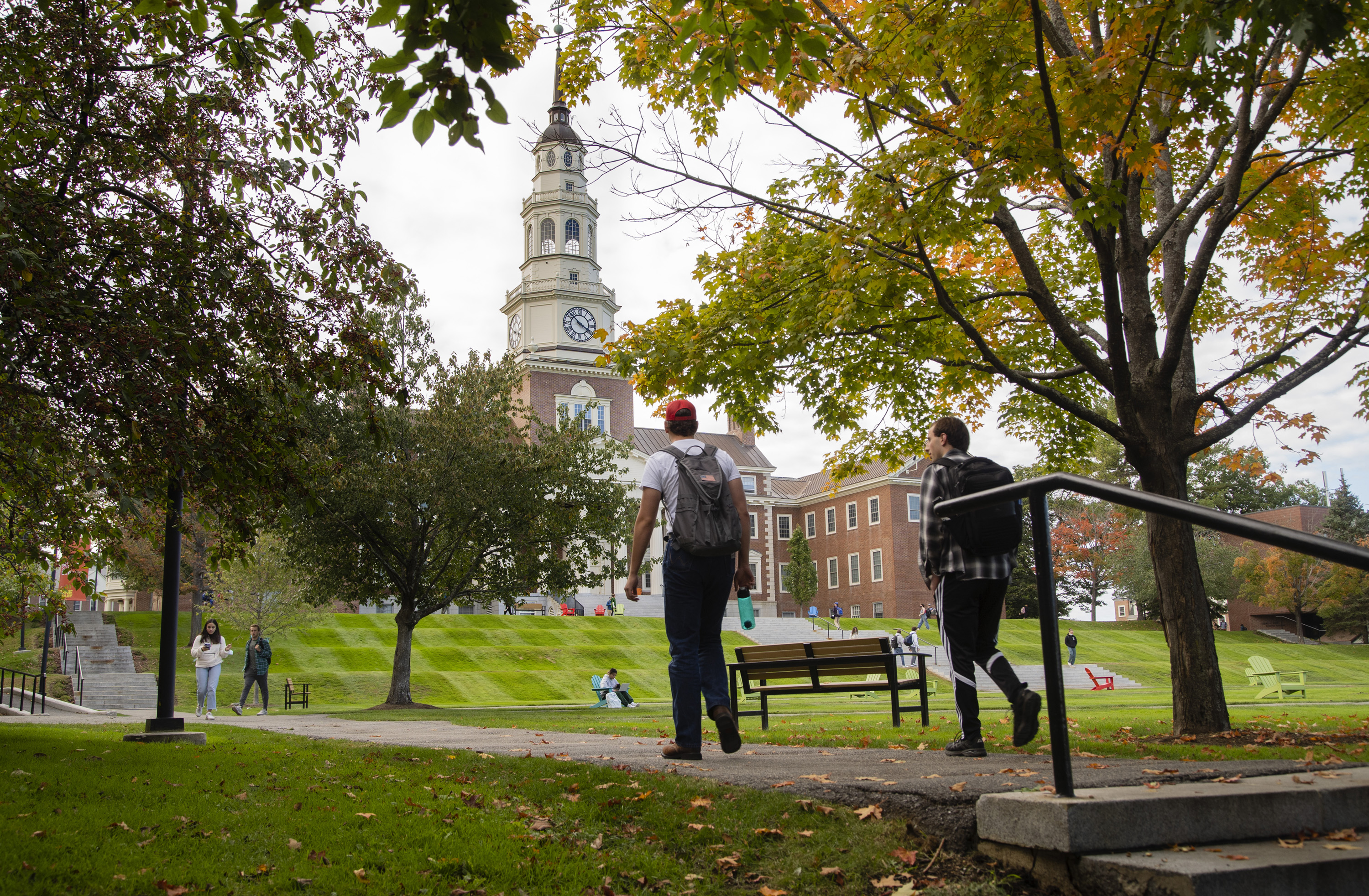 Colby College students move past Miller Library on the Waterville, Maine campus.