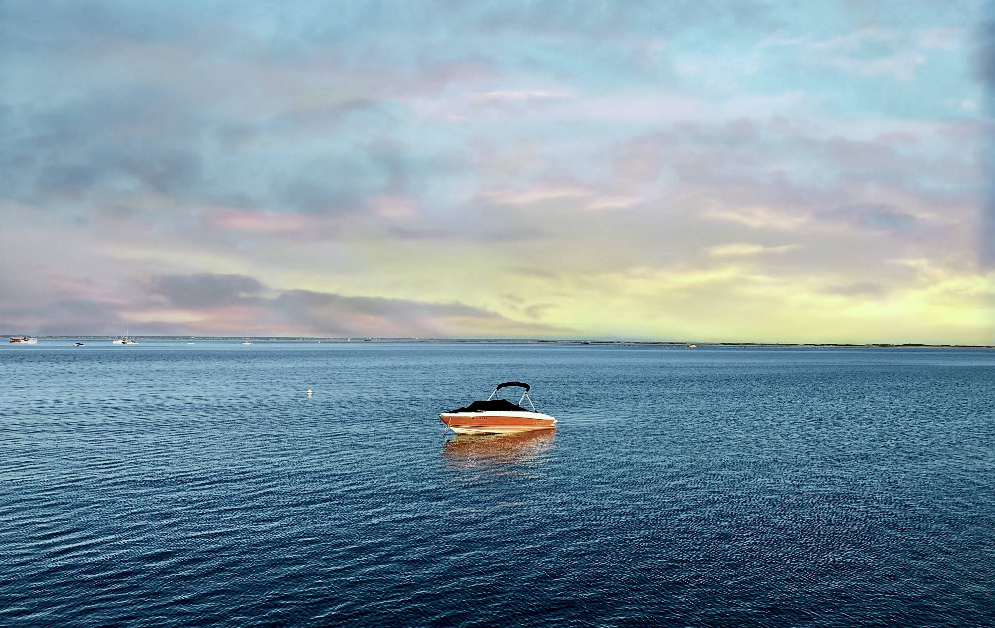A solitary boat sat in Provincetown Harbor during the off-season. Town leaders are hoping for a quiet summer season to curtail the spread of COVID-19 to the town's at-risk residents.