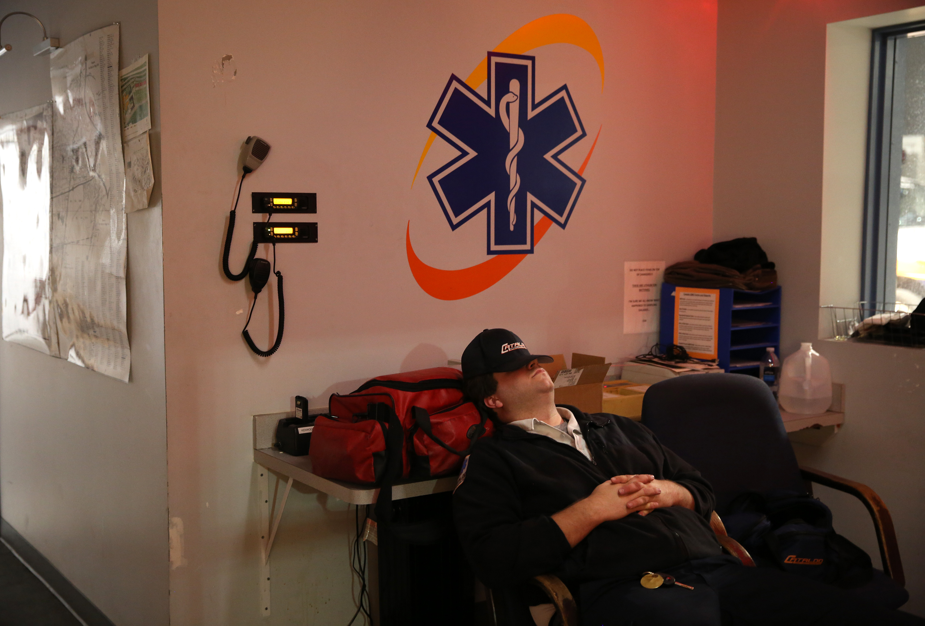 Monday, 10:17 p.m. EMT Mike O’Hara napped between calls in the Cataldo break room.