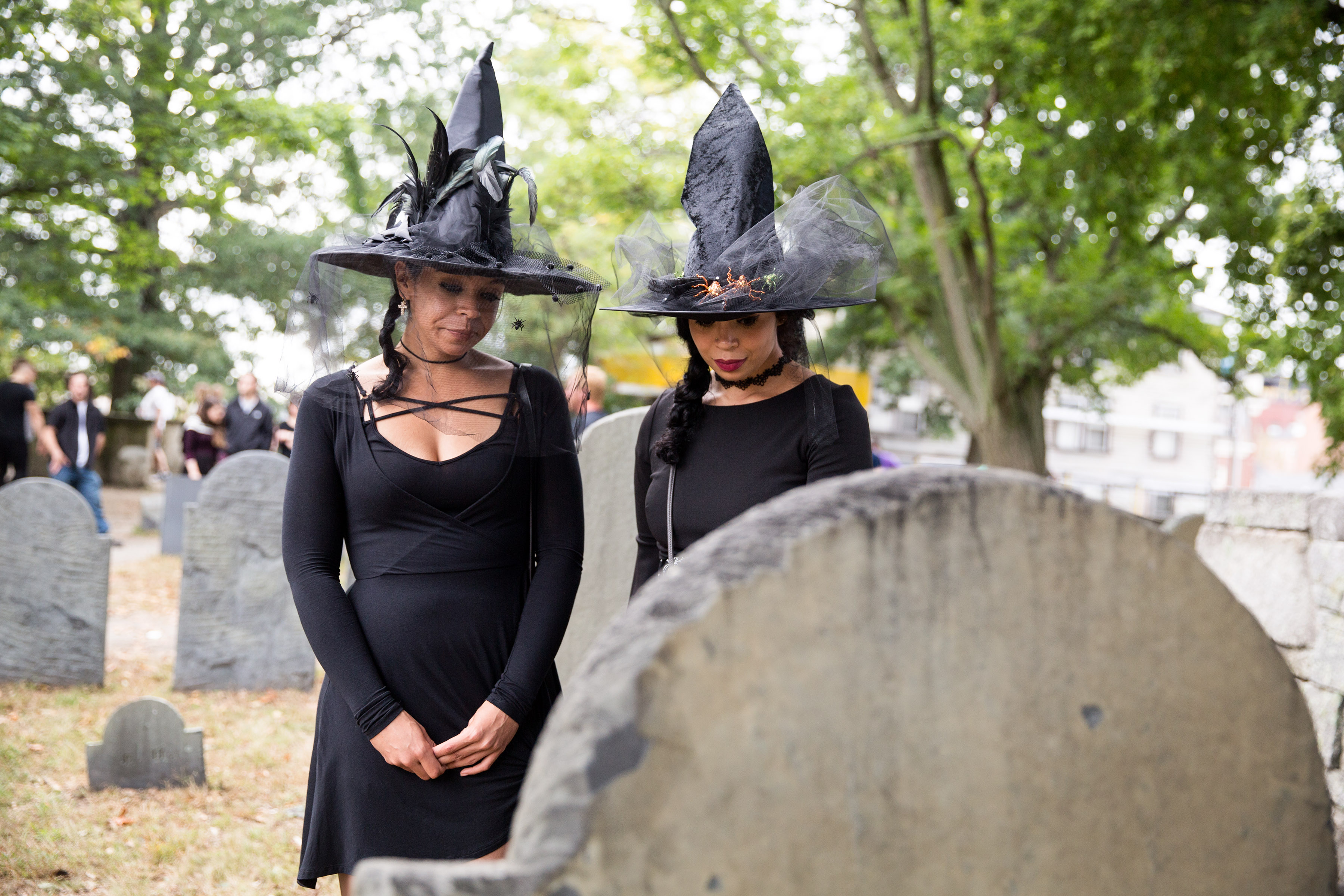 Sisters Kristen Rose (left) and Brittney Rose, dressed as witches, explored the Old Salem Burying Ground during Salem Haunted Happenings on Oct. 8, 2017, in Salem.