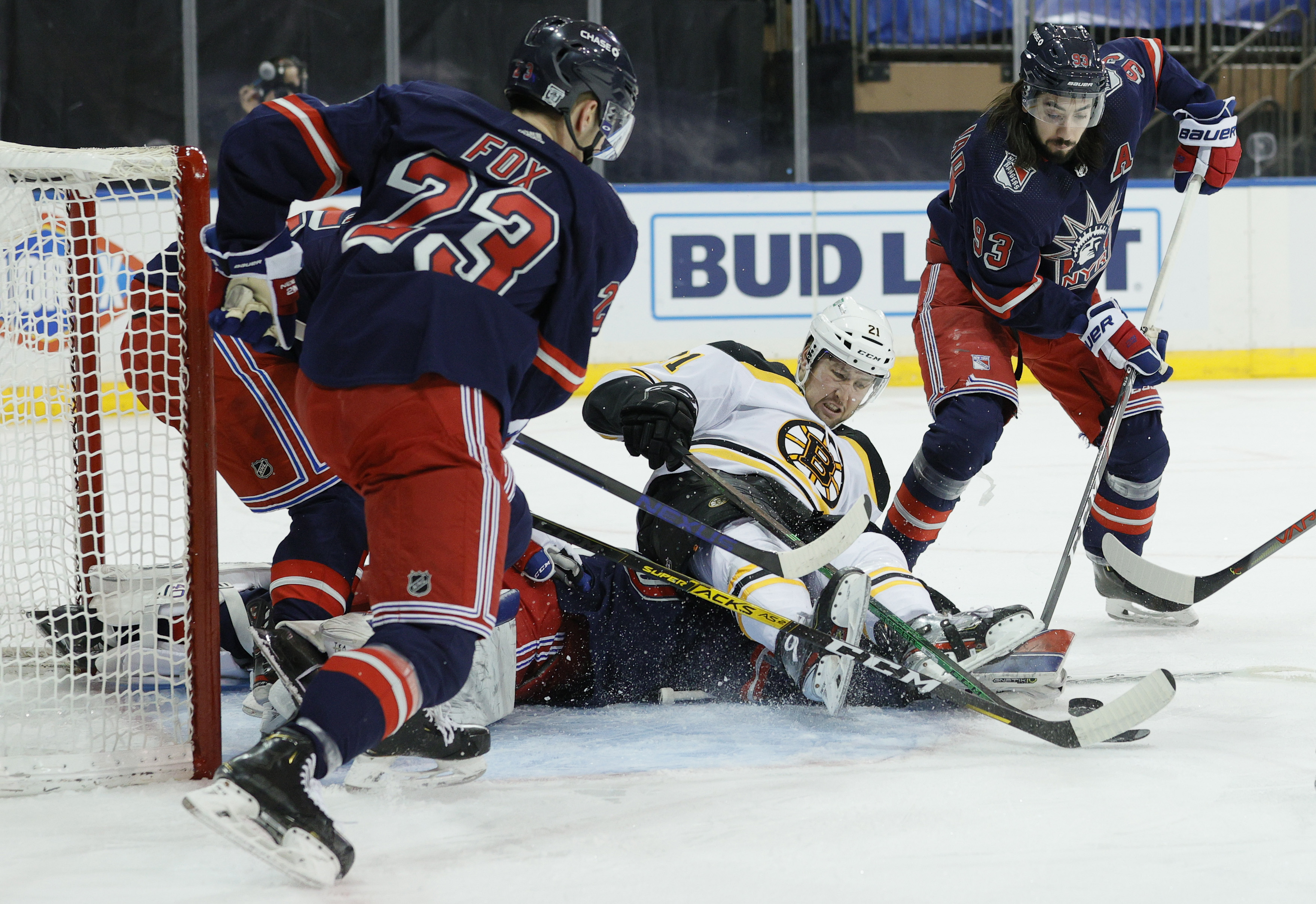 Nick Ritchie falls on top of Rangers goalie Alexandar Georgiev early in Sunday's 4-1 Bruins victory at Madison Square Garden.