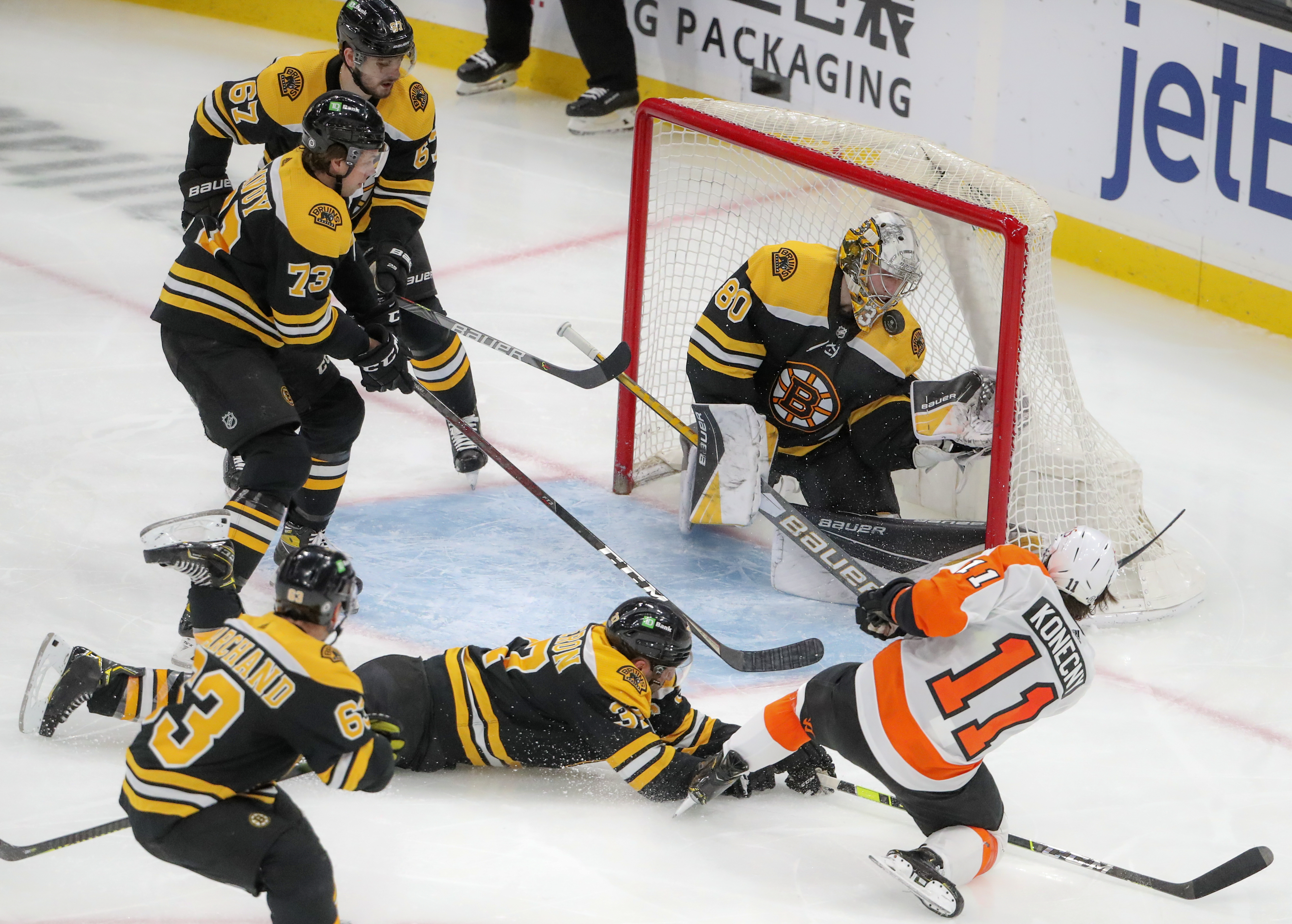 Dan Vladar makes a save on the Flyers' Travis Konecny during a second-period power play Monday night.