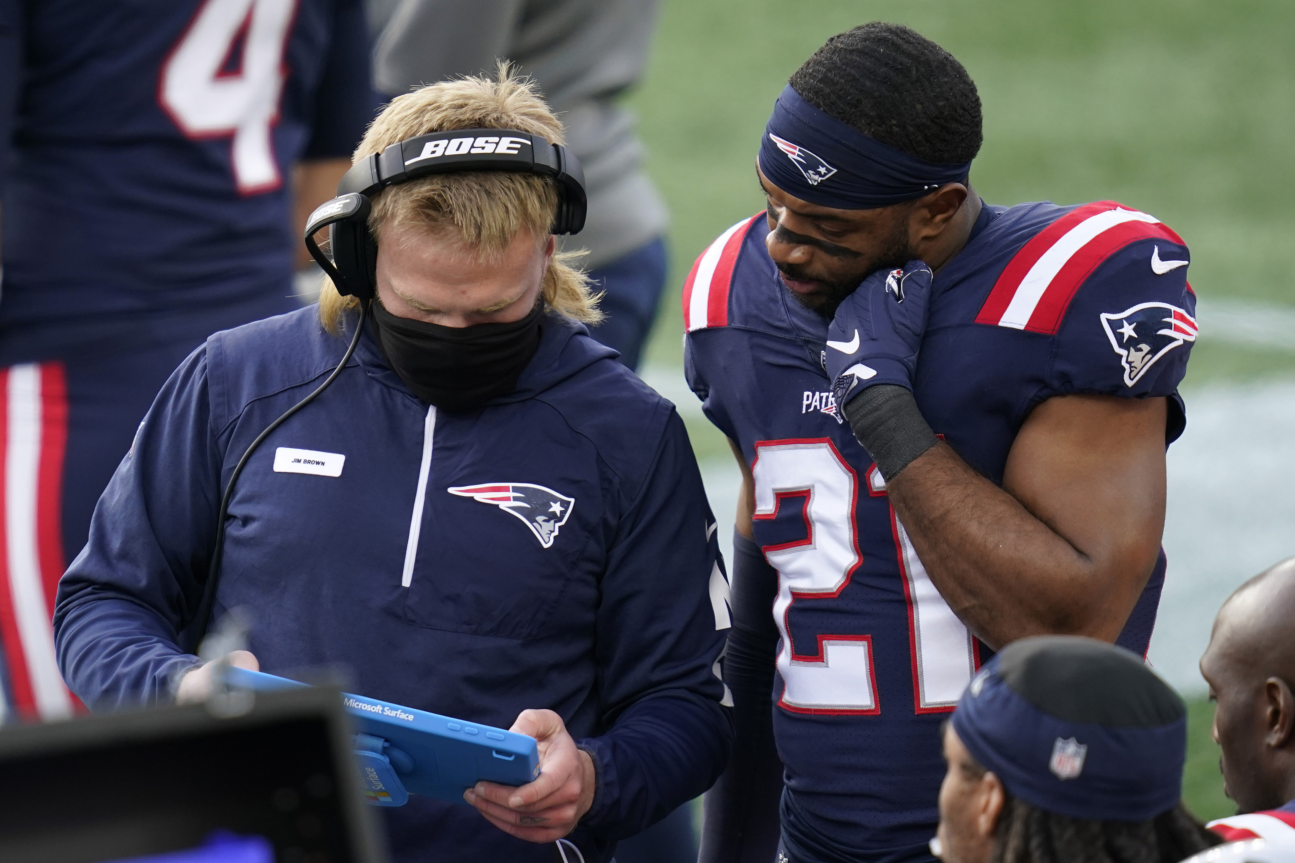 Outside linebackers coach Steve Belichick, left, had his Jim Brown patch on during New England's game against San Francisco on Oct. 25.