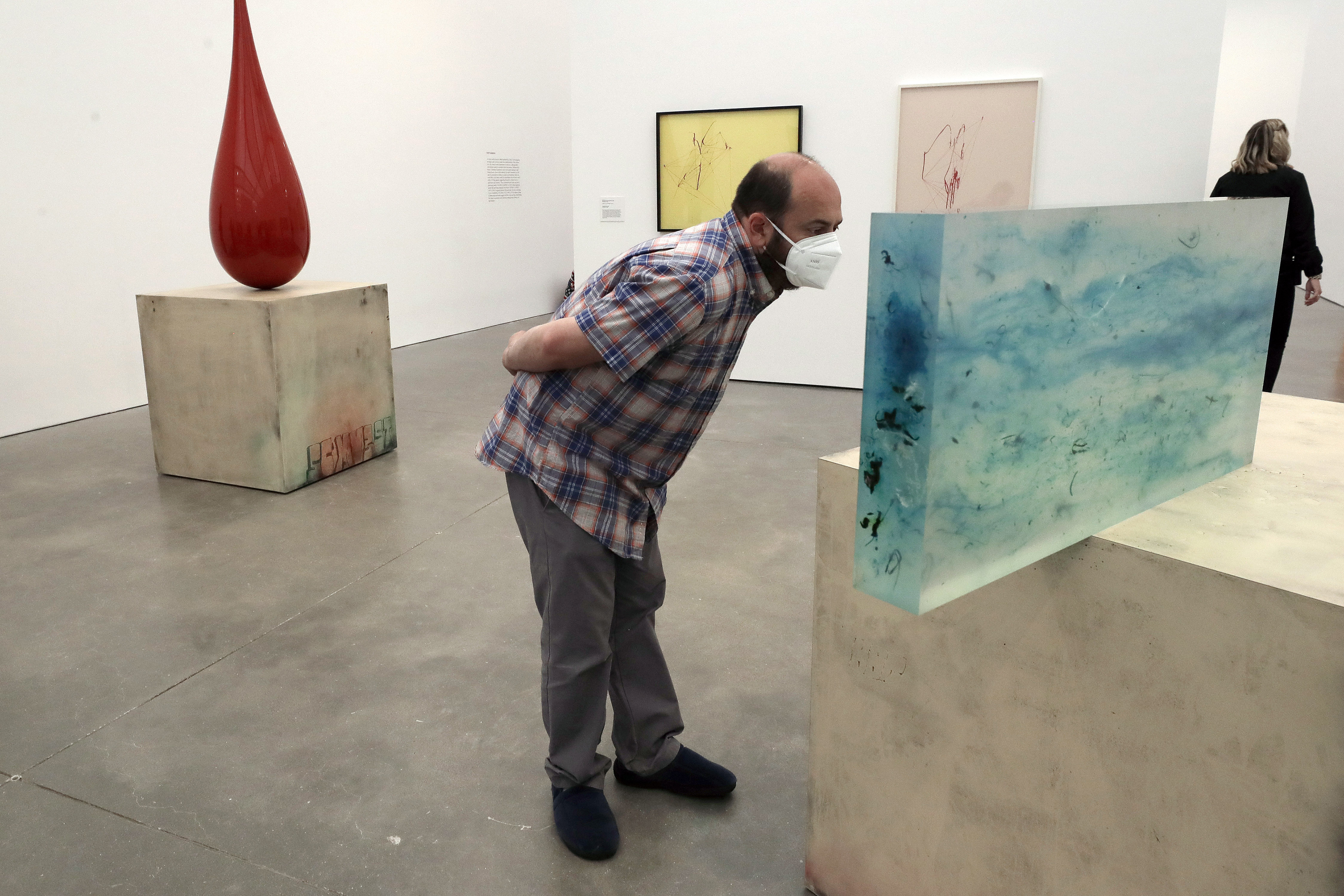 Jeffrey Gato, of Ashland, looked over a Sterling Ruby sculpture on July 15, reopening day at Boston's Institute of Contemporary Art.